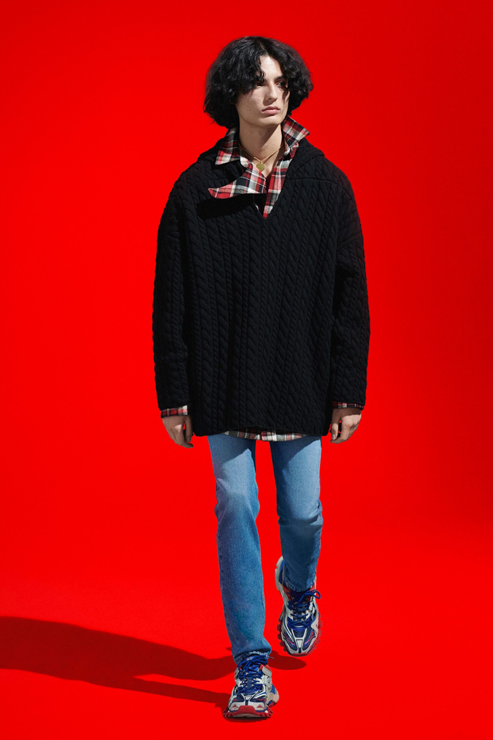 black relaxed sweater with checked shirt