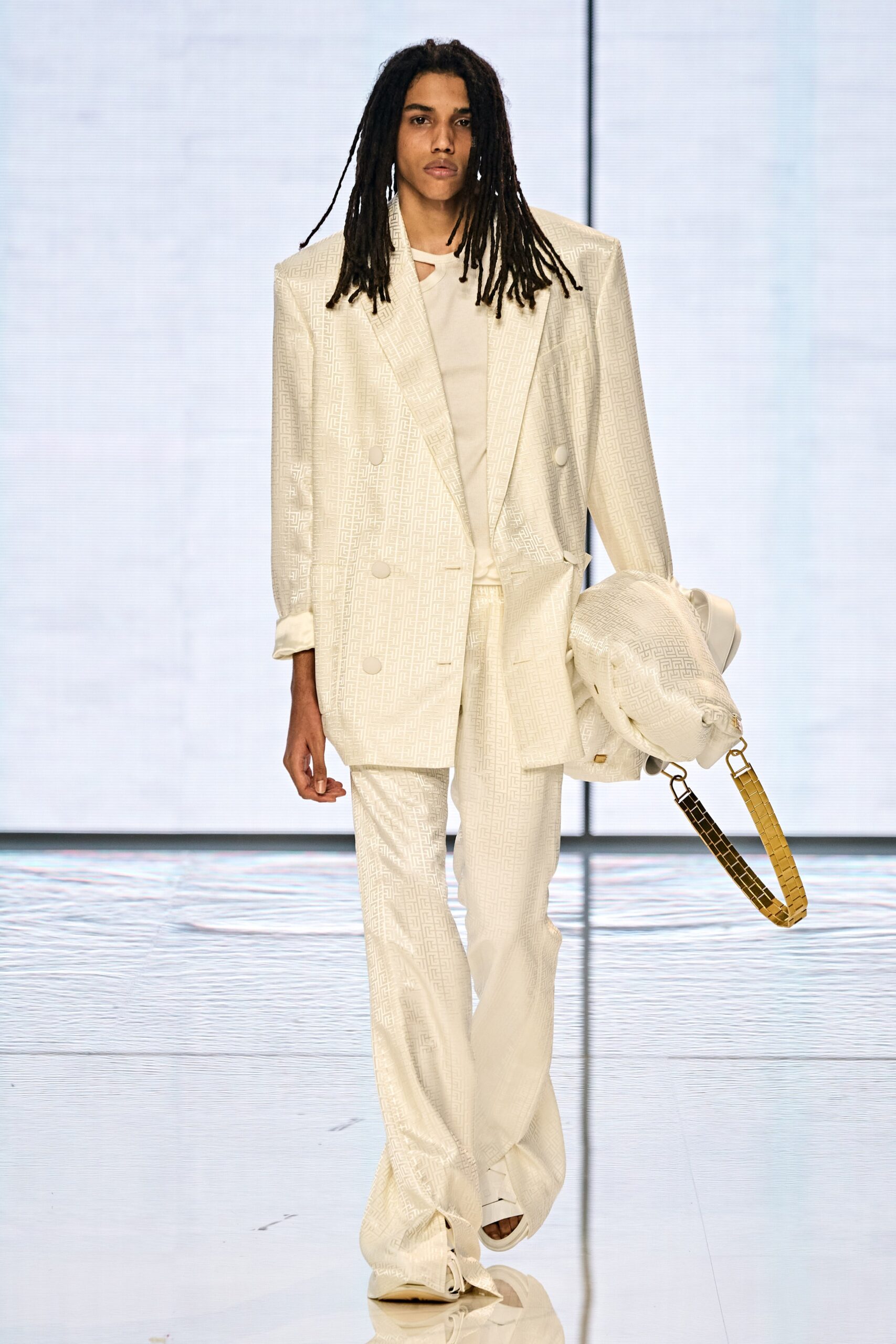 white tailored suit with bag