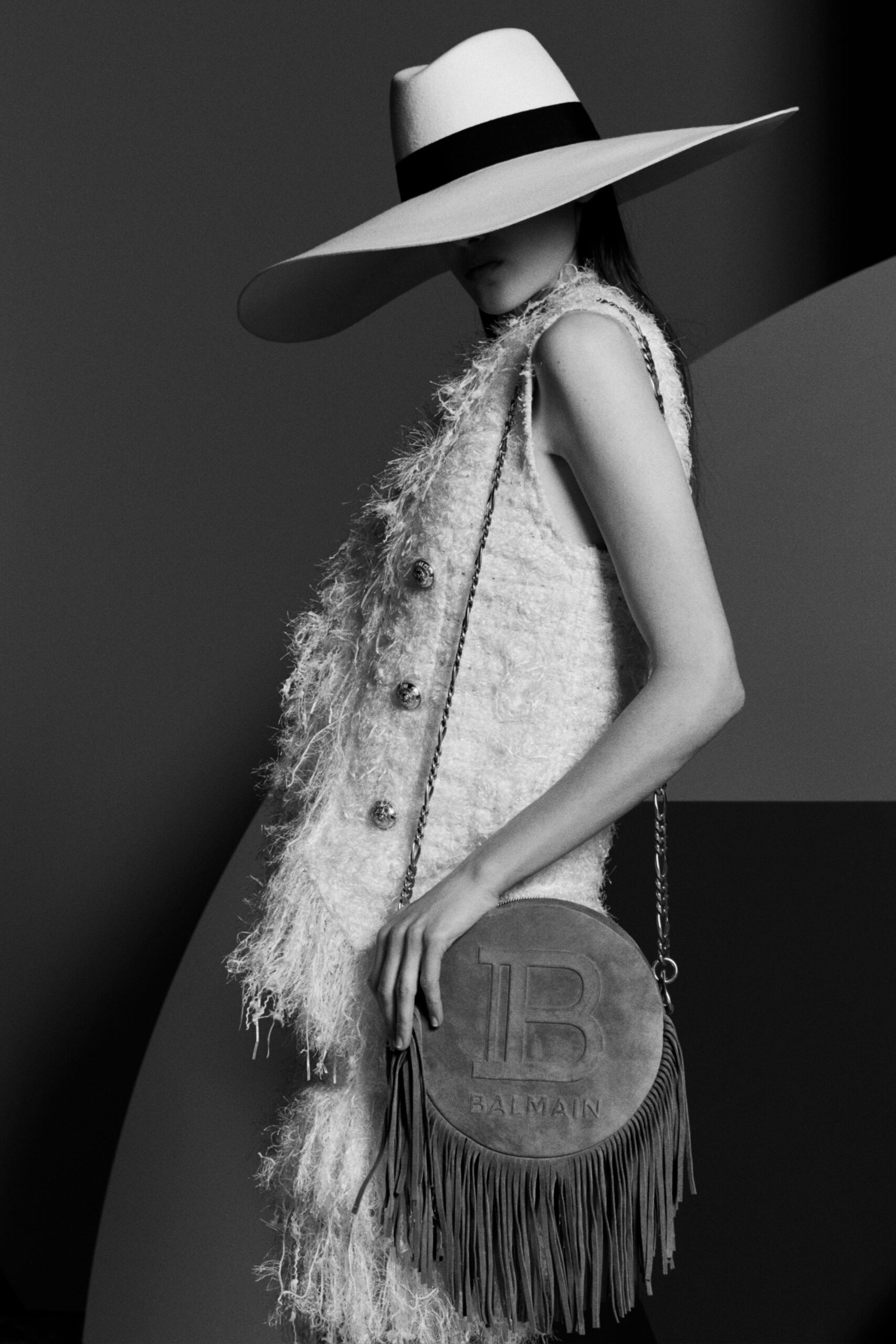 white wool sleeveless collared fitted fringed buttoned vest