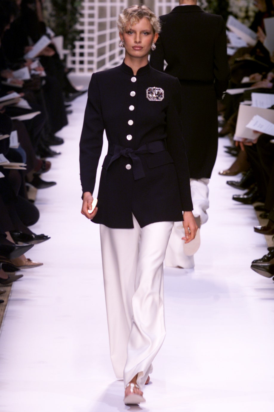 black tailored blazer with white pants