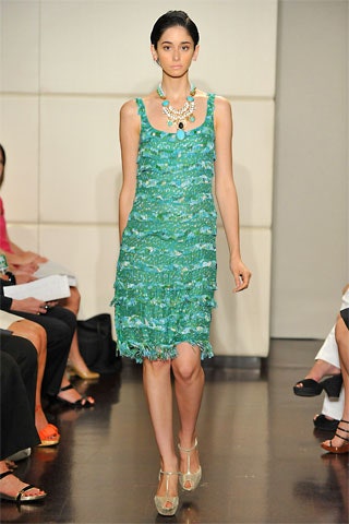 green ruffled sleeveless dress