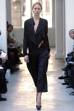 black silk fitted jacket and relaxed pants