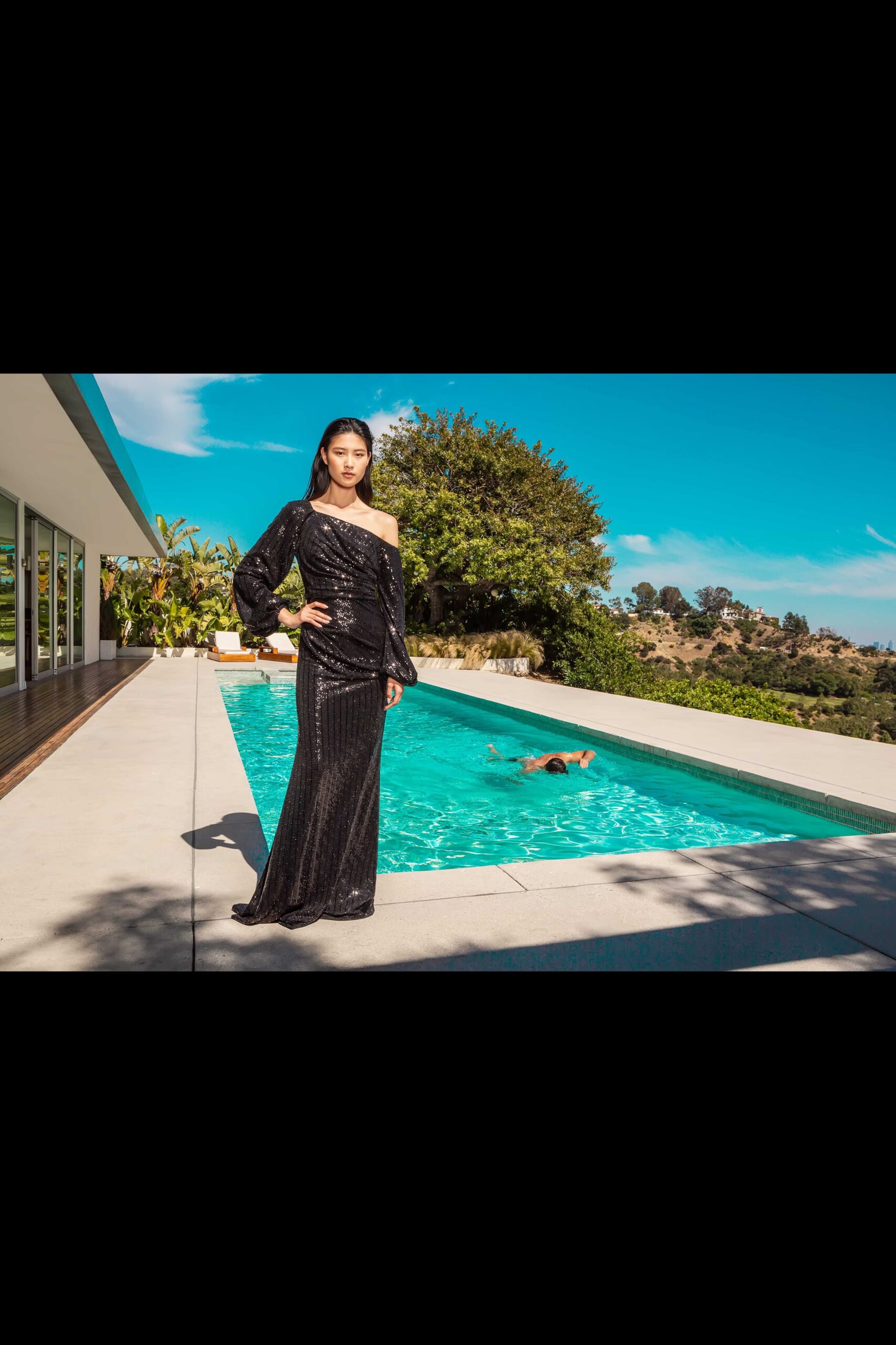 black sequin off-shoulder gown