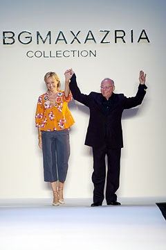 orange embroidered top with gray cropped pants