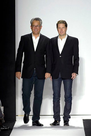 black tailored blazer and blue jeans