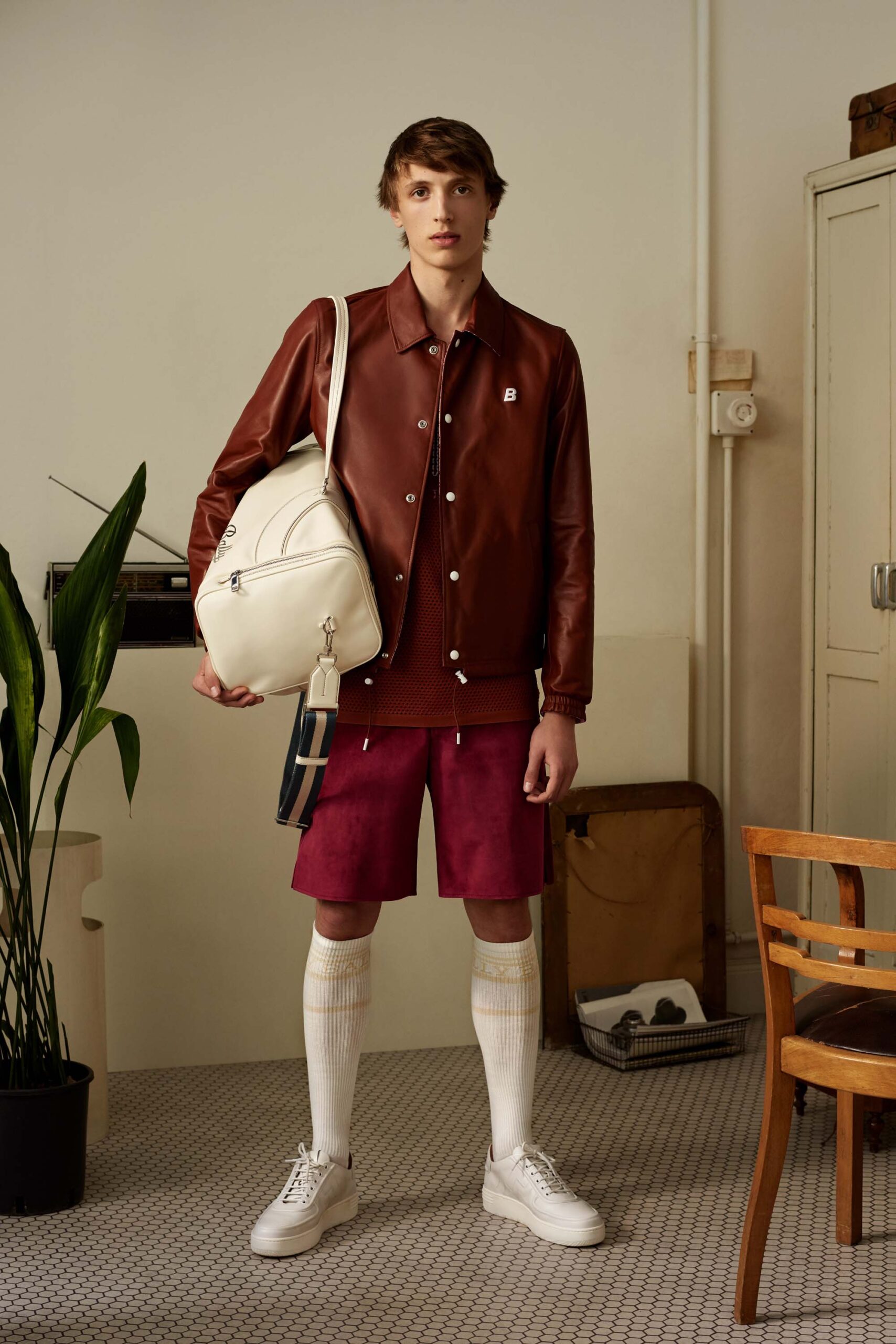 brown leather jacket with red shorts