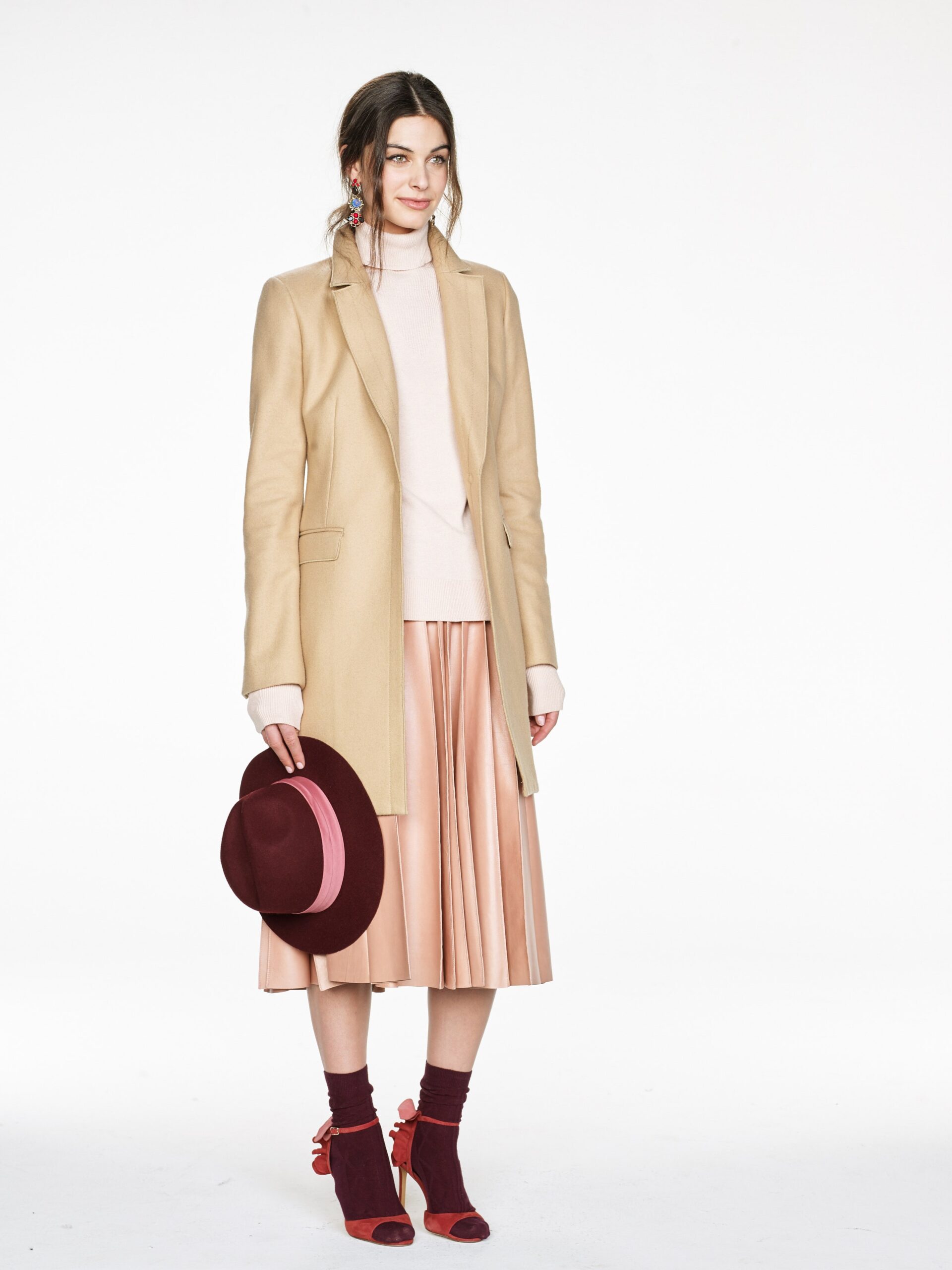 beige coat with pleated pink skirt