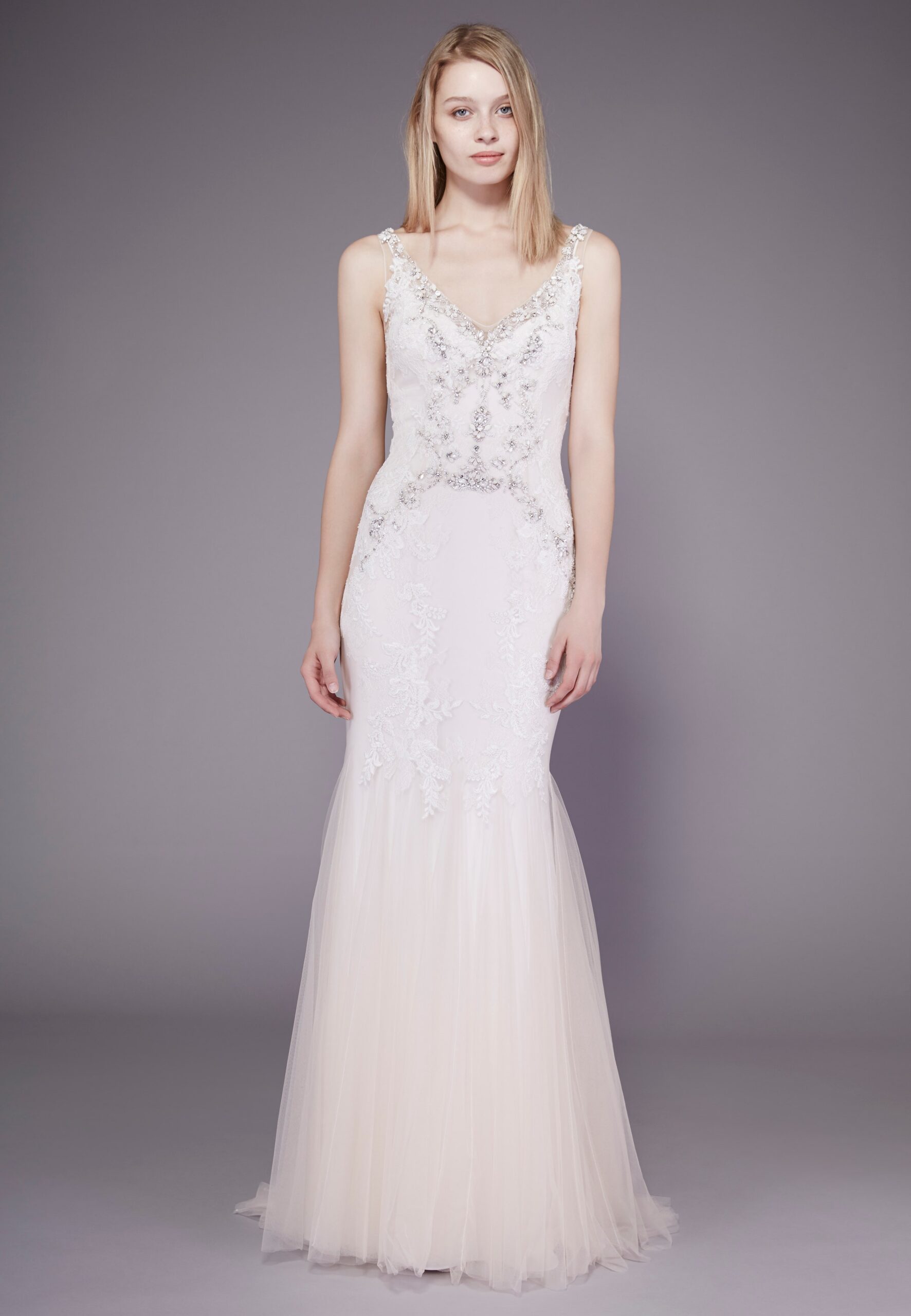 white embroidered sleeveless gown