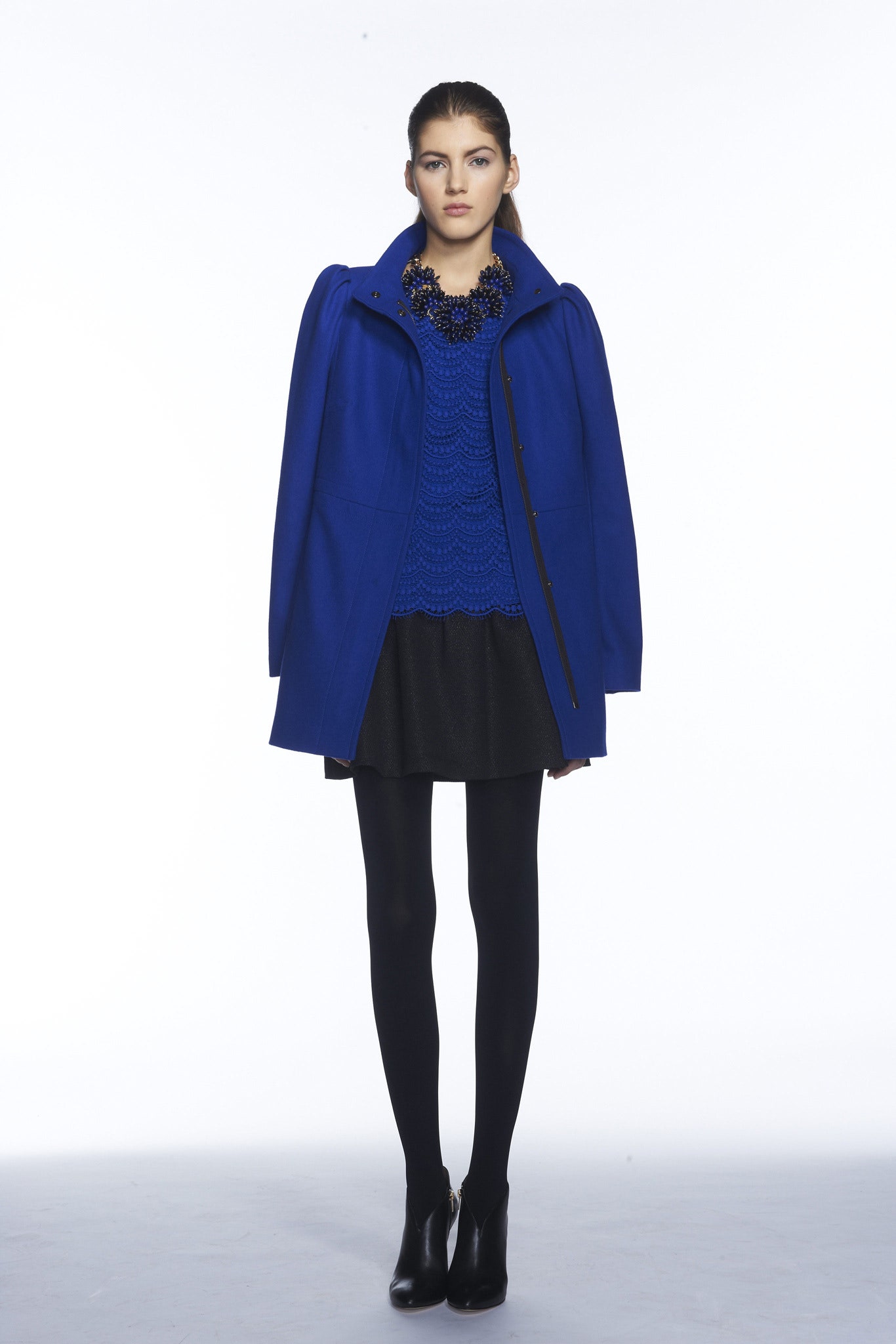 blue wool coat with black skirt