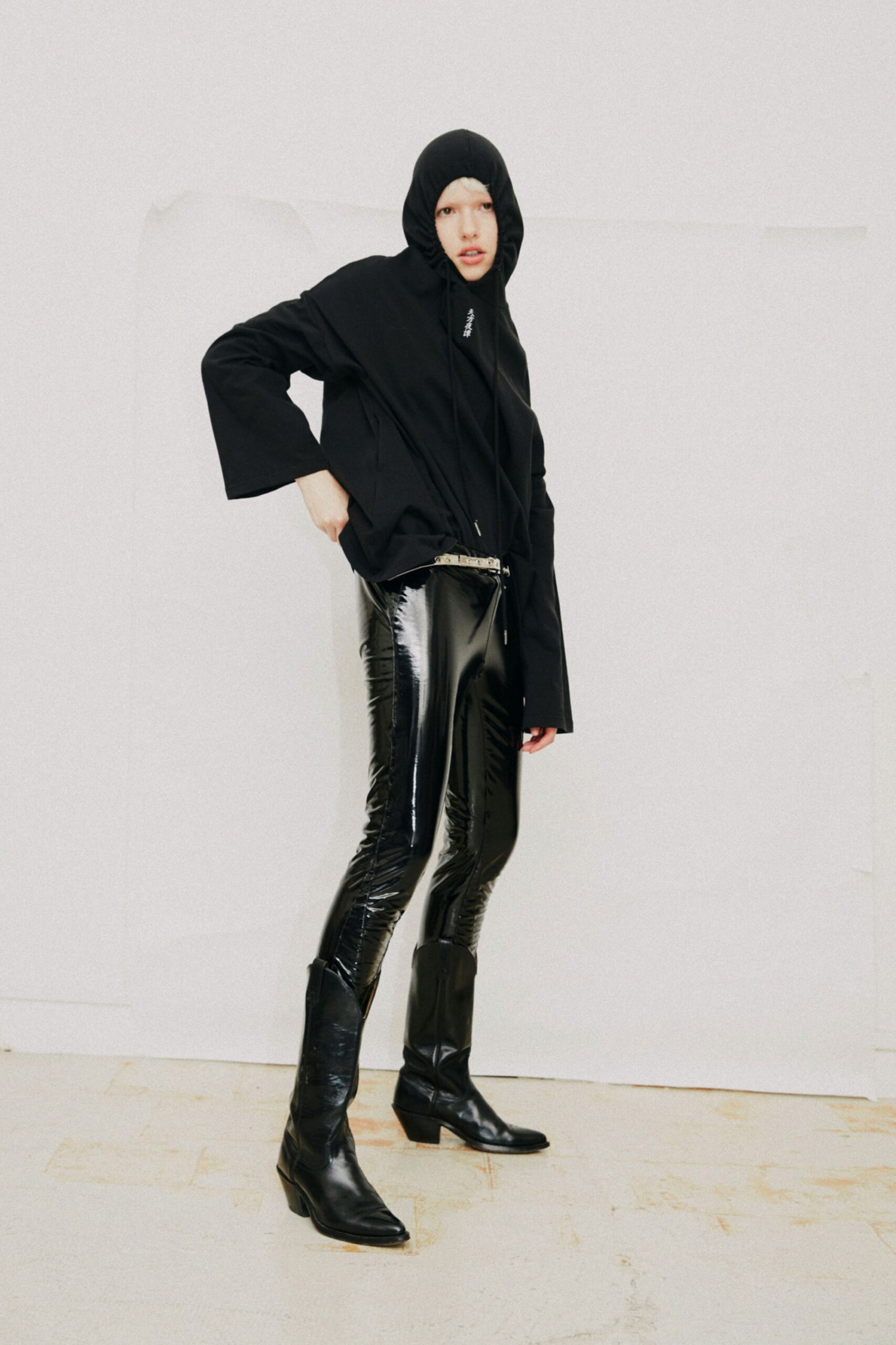black hoodie vinyl pants boots