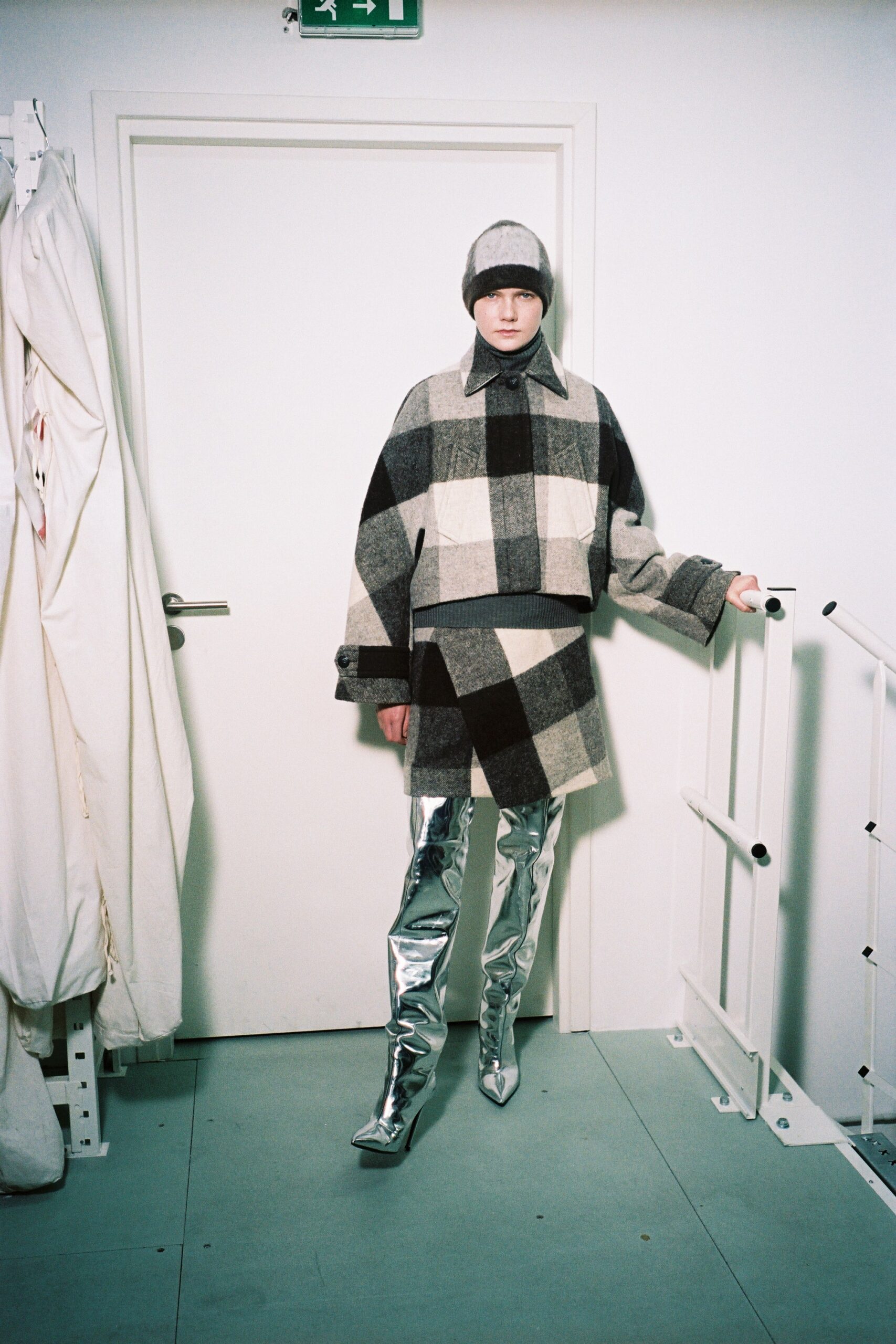 oversized checked coat with silver boots