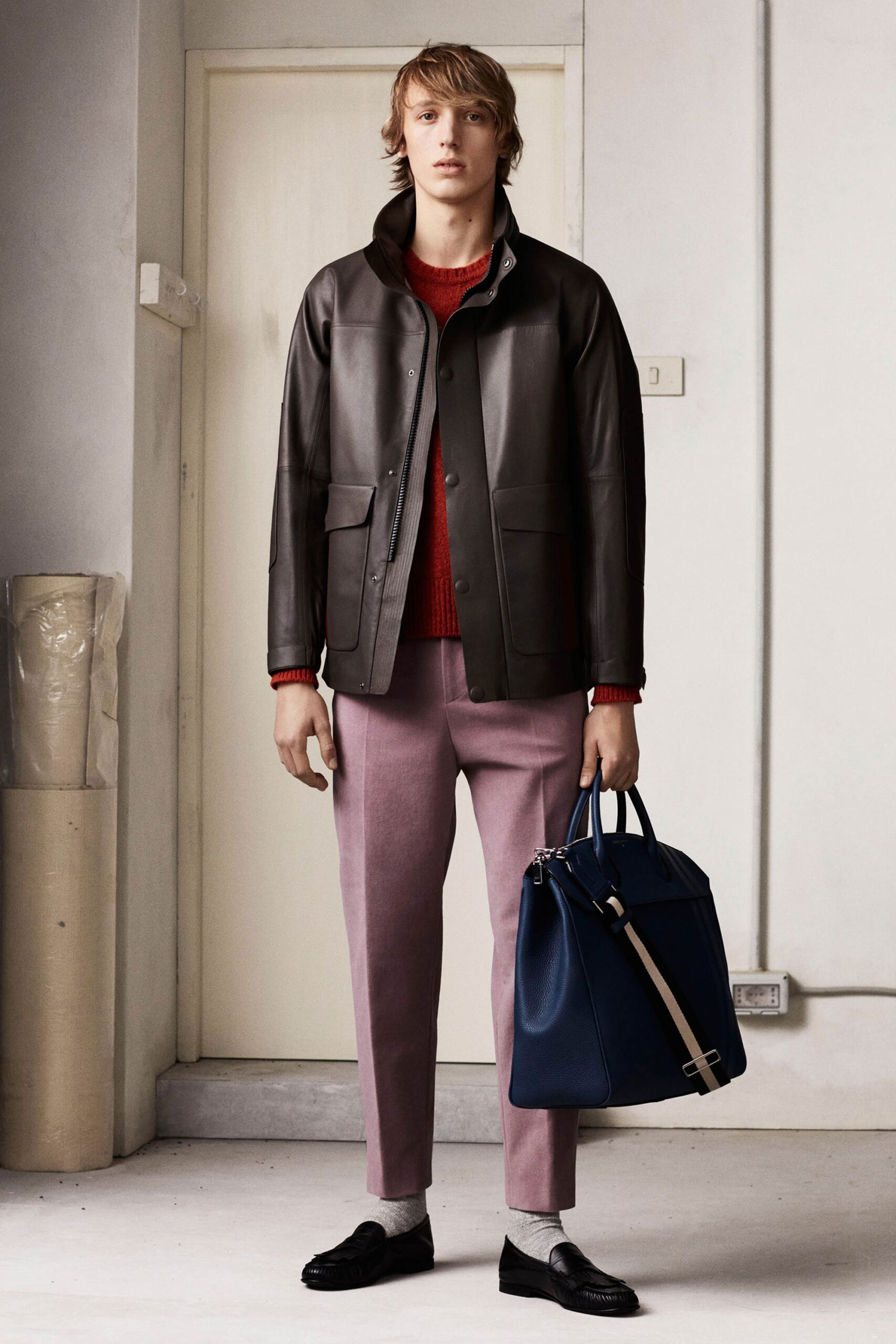 black leather jacket with red sweater