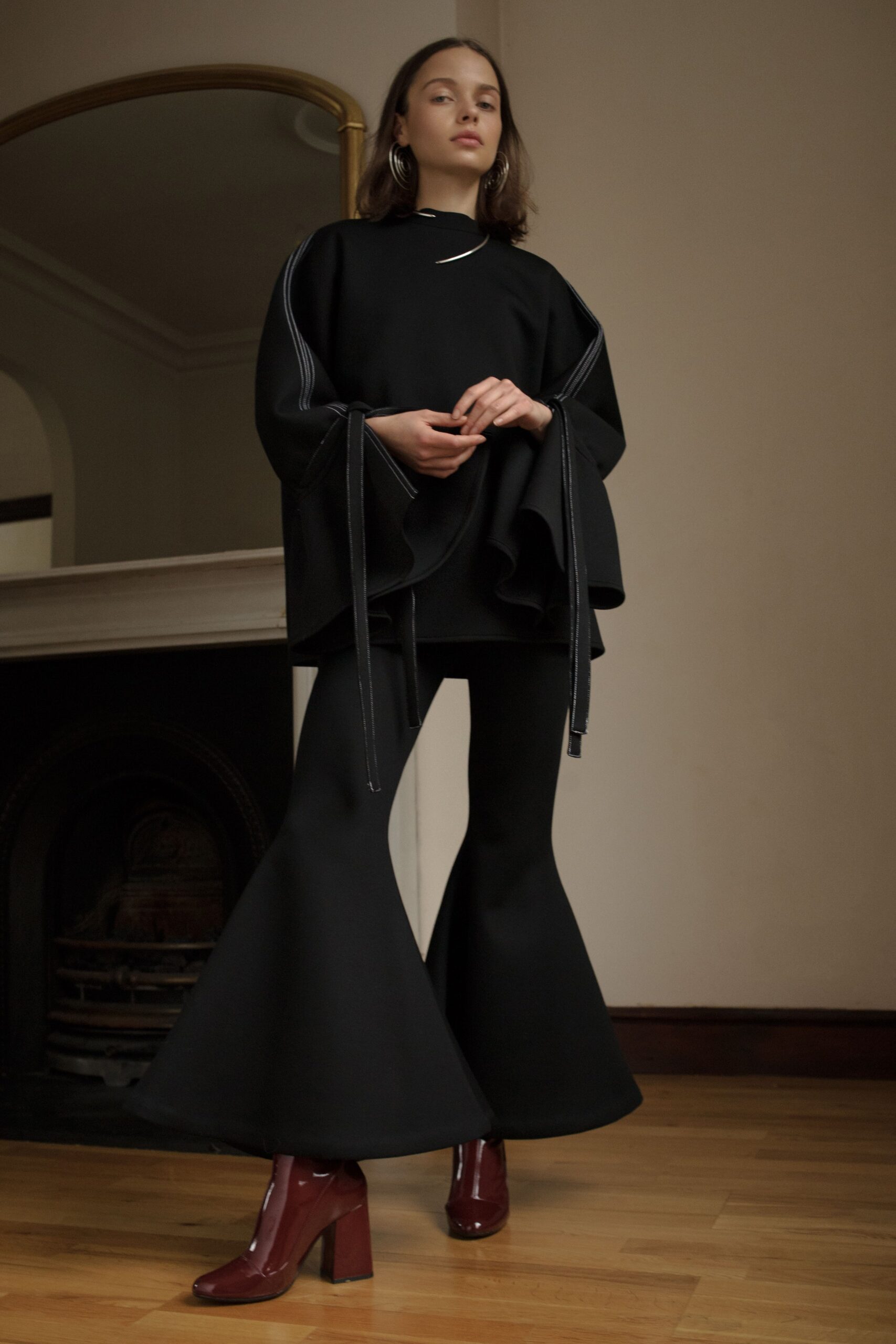 black ruffled high-neck top
