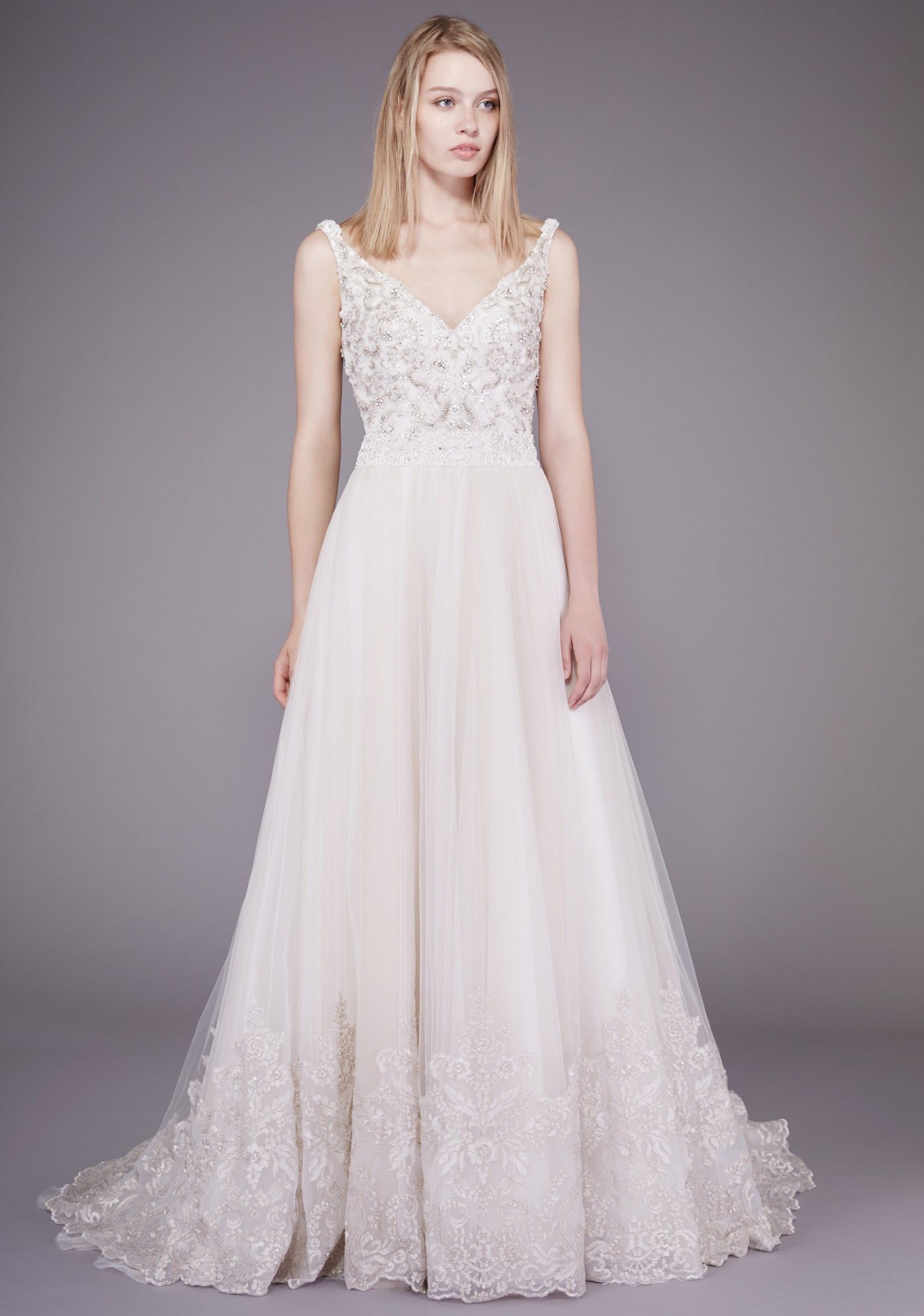 white embroidered sleeveless gown