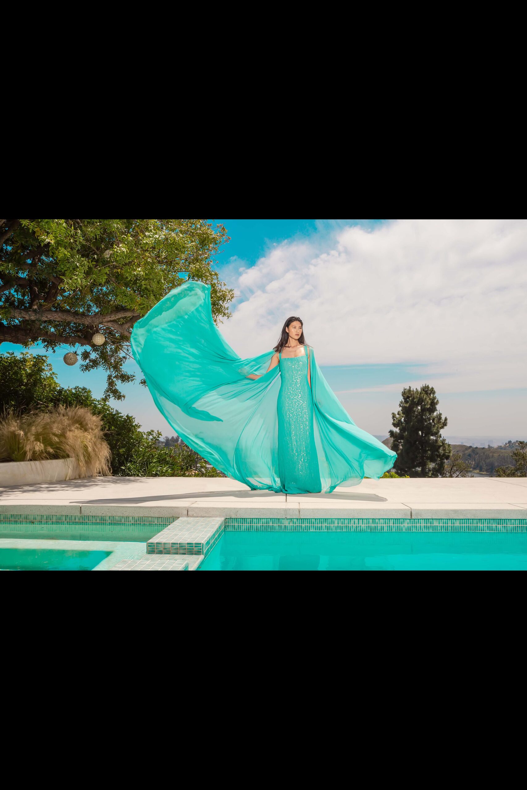 teal silk gown with cape