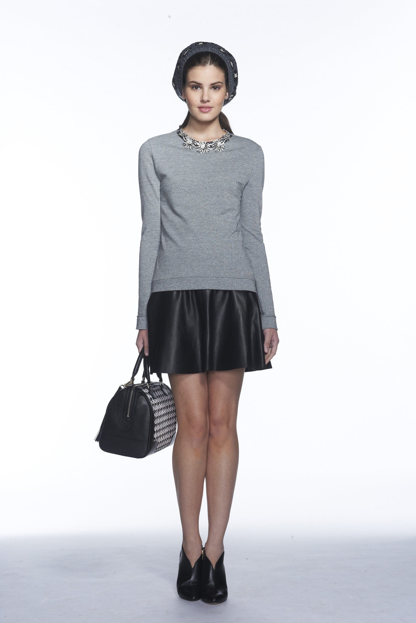 gray fitted top with black skirt