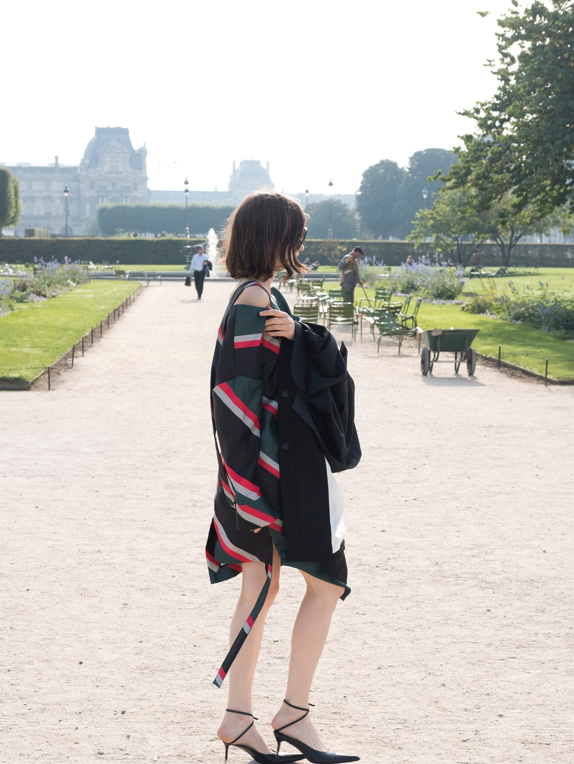 black fitted dress with layered coat