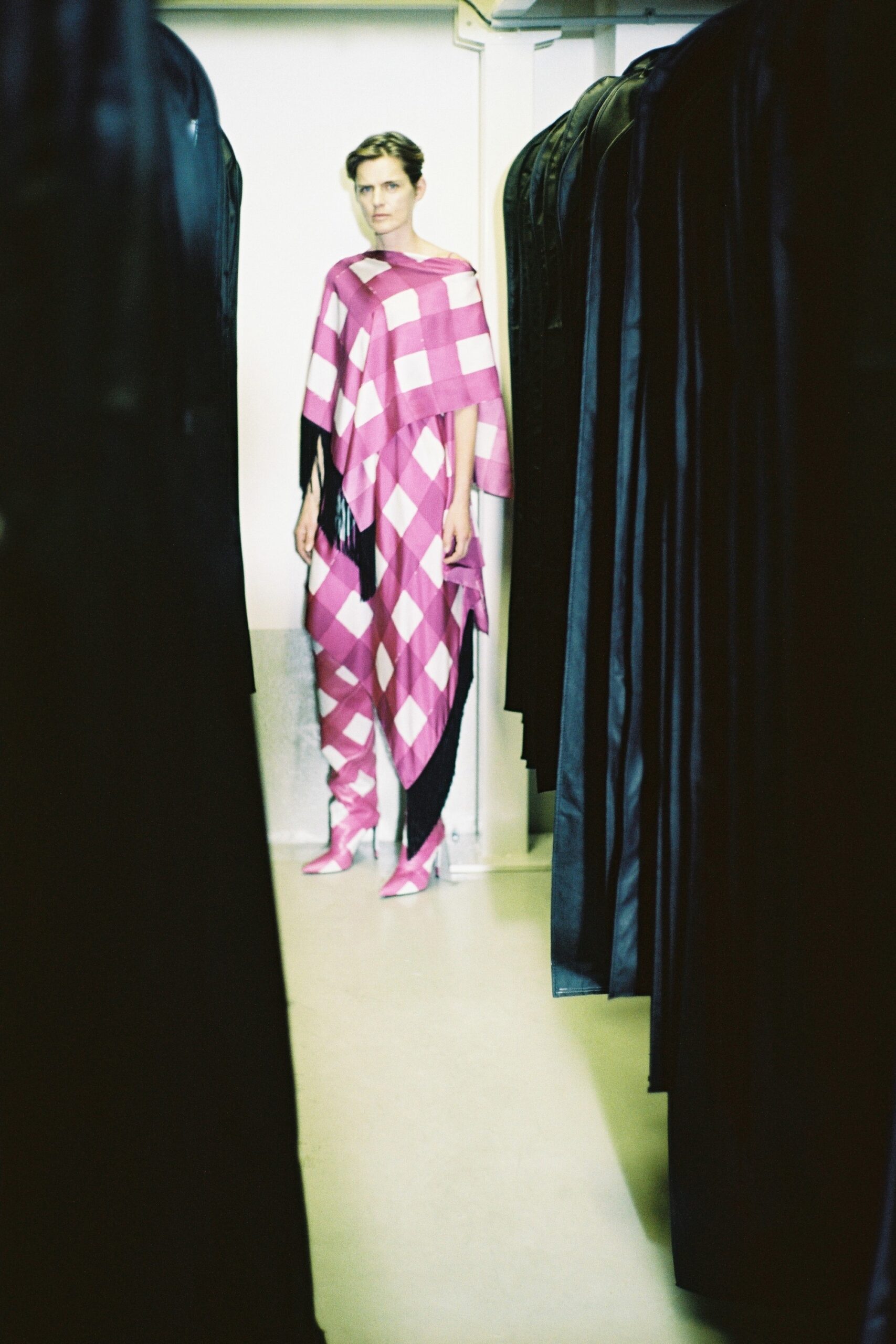 pink checked poncho with fitted pants