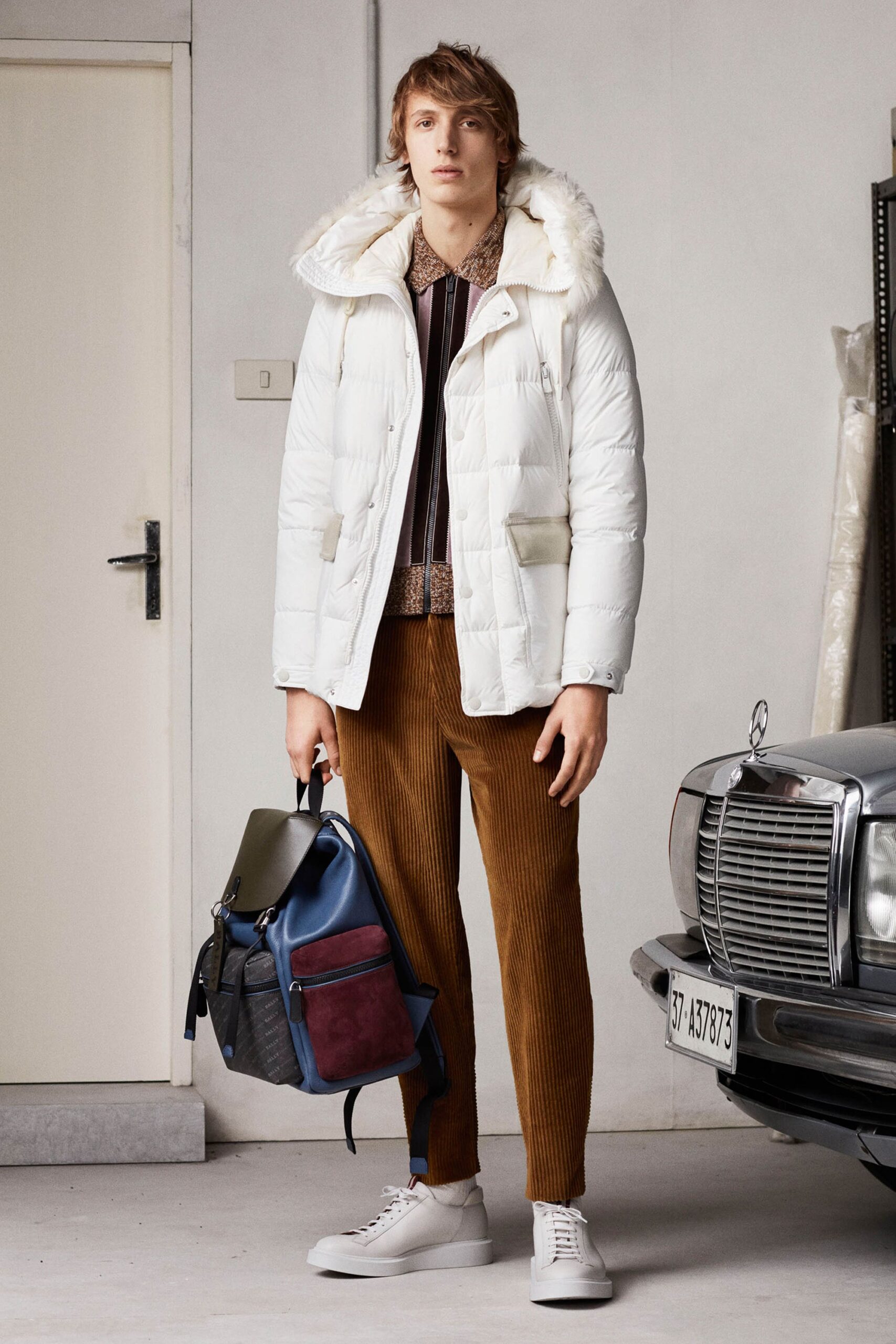 white faux-fur jacket with brown shirt