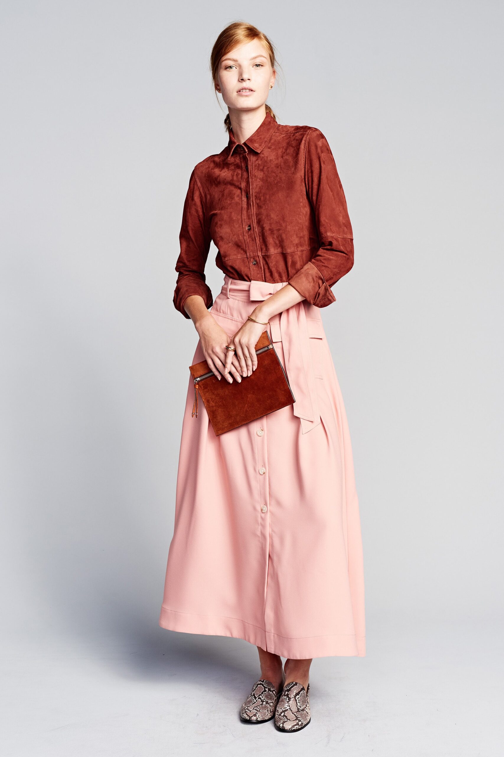 brown suede shirt and pink skirt