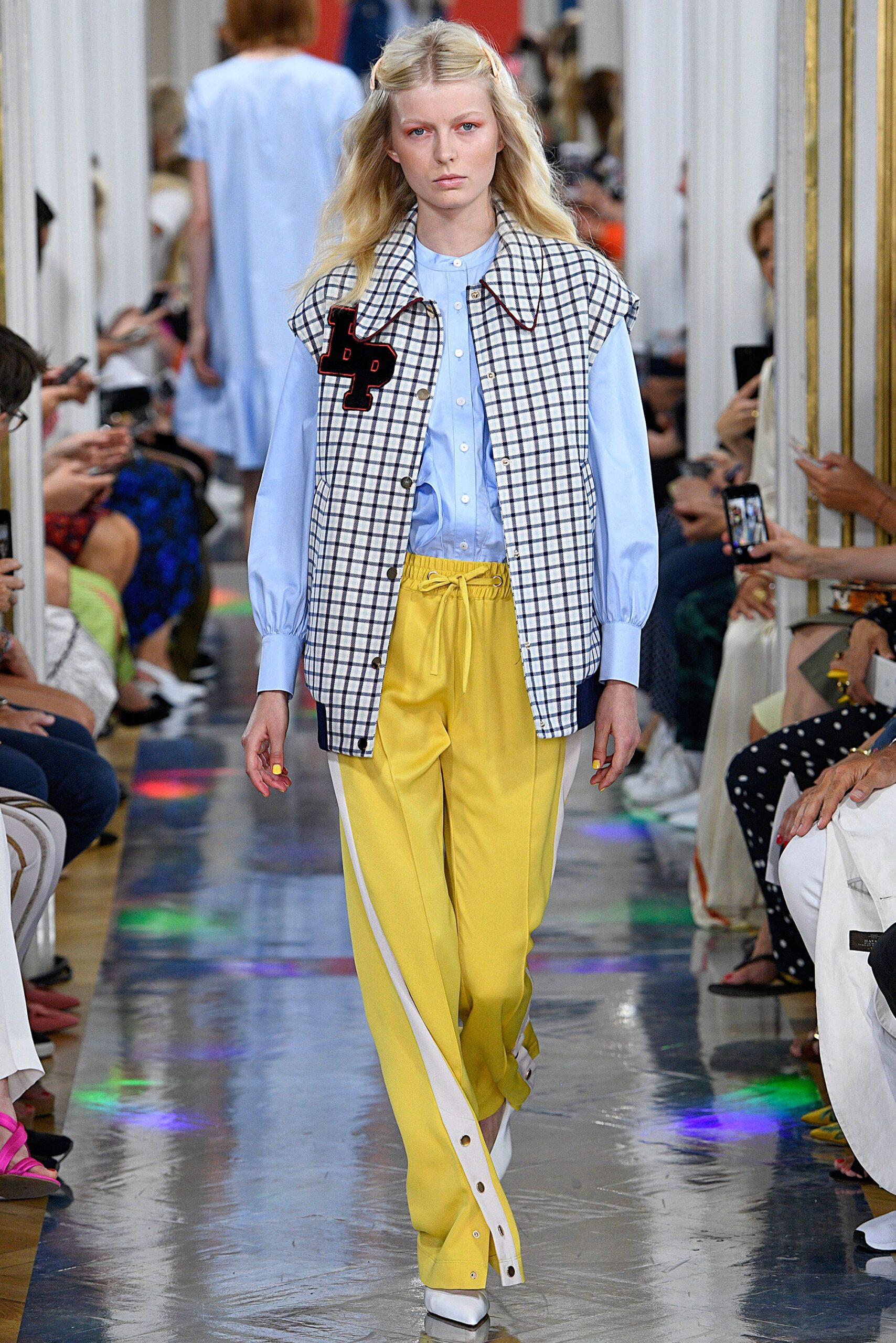 blue shirt with checked vest and yellow pants