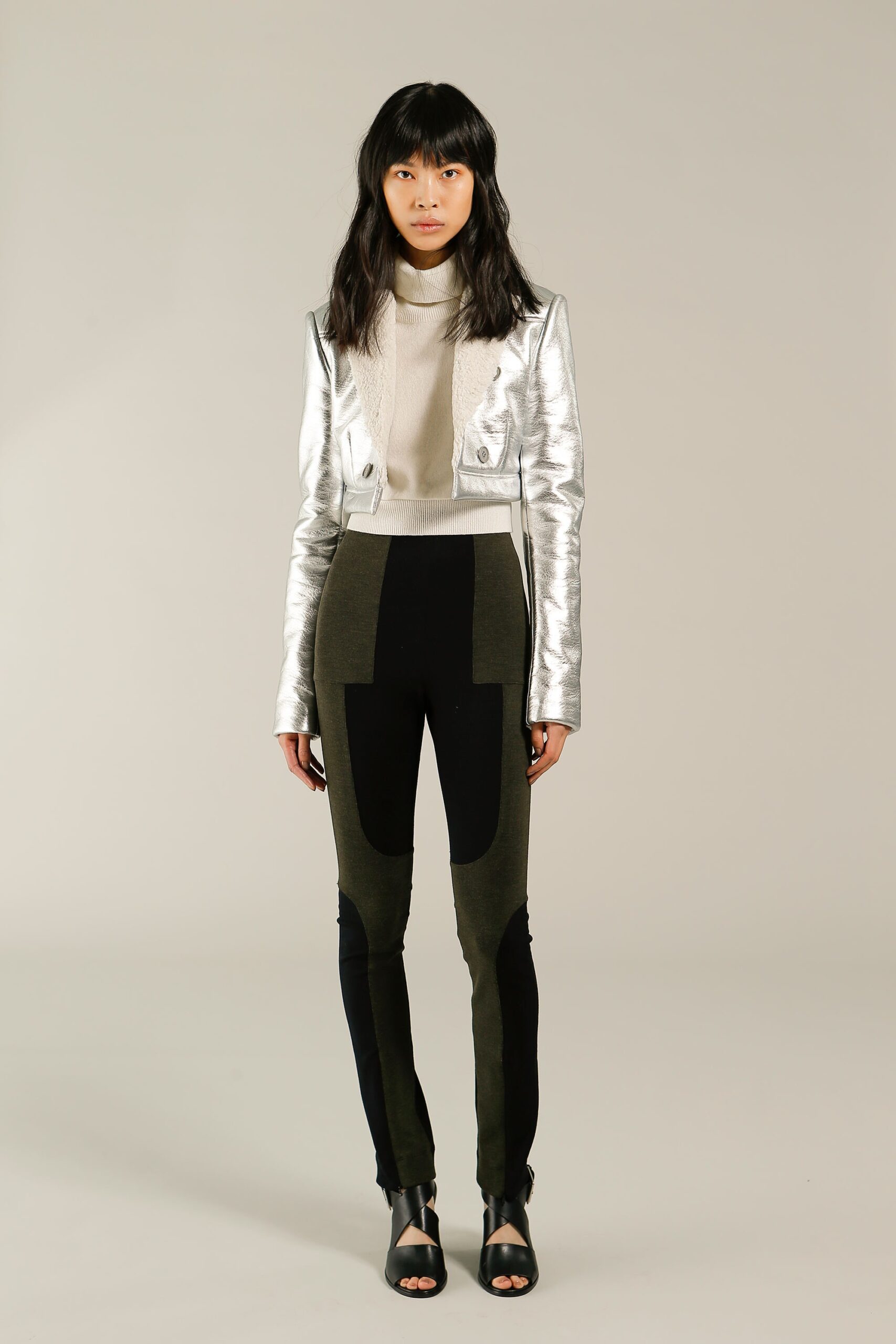 silver fitted jacket with beige top