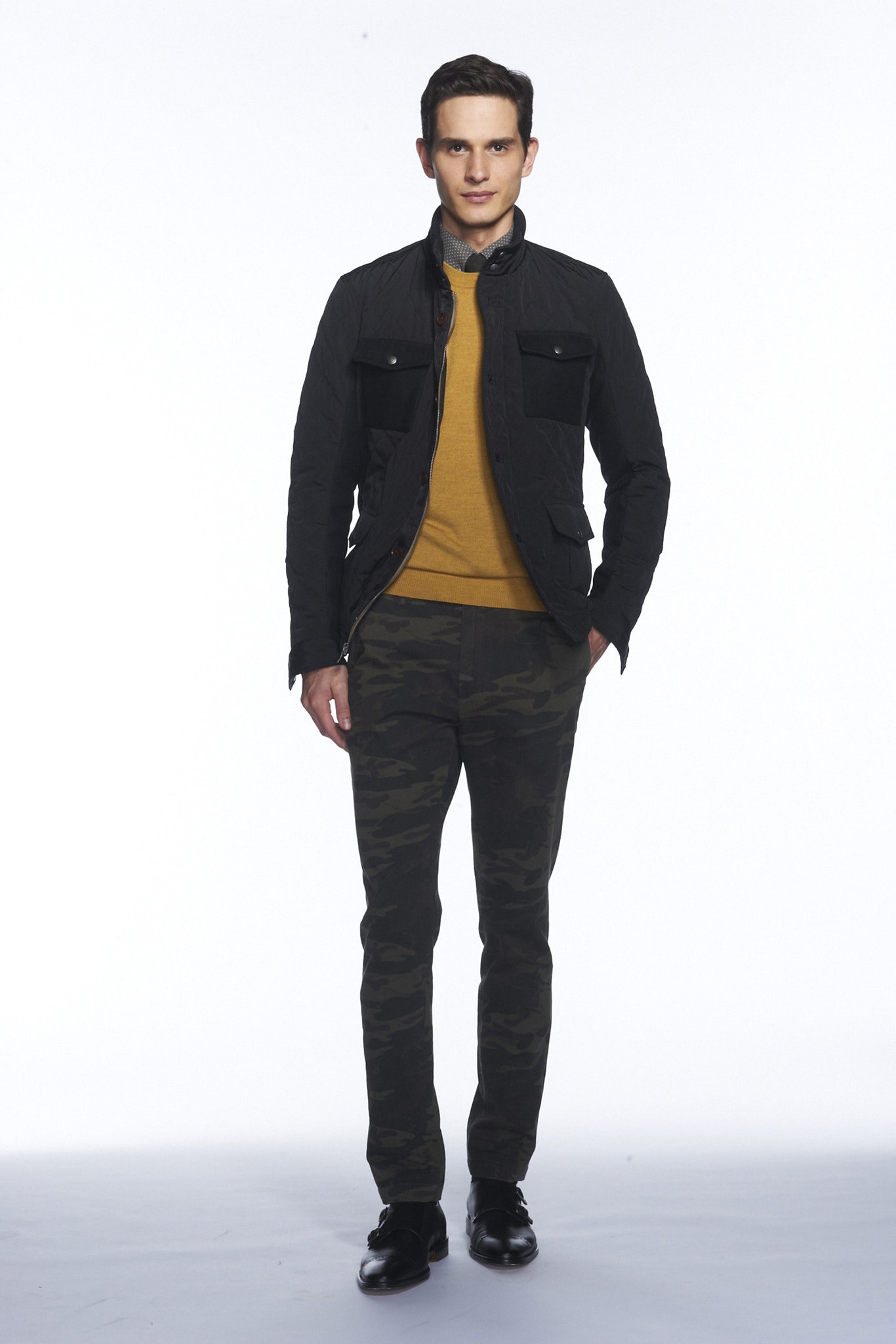 black jacket yellow sweater green pants