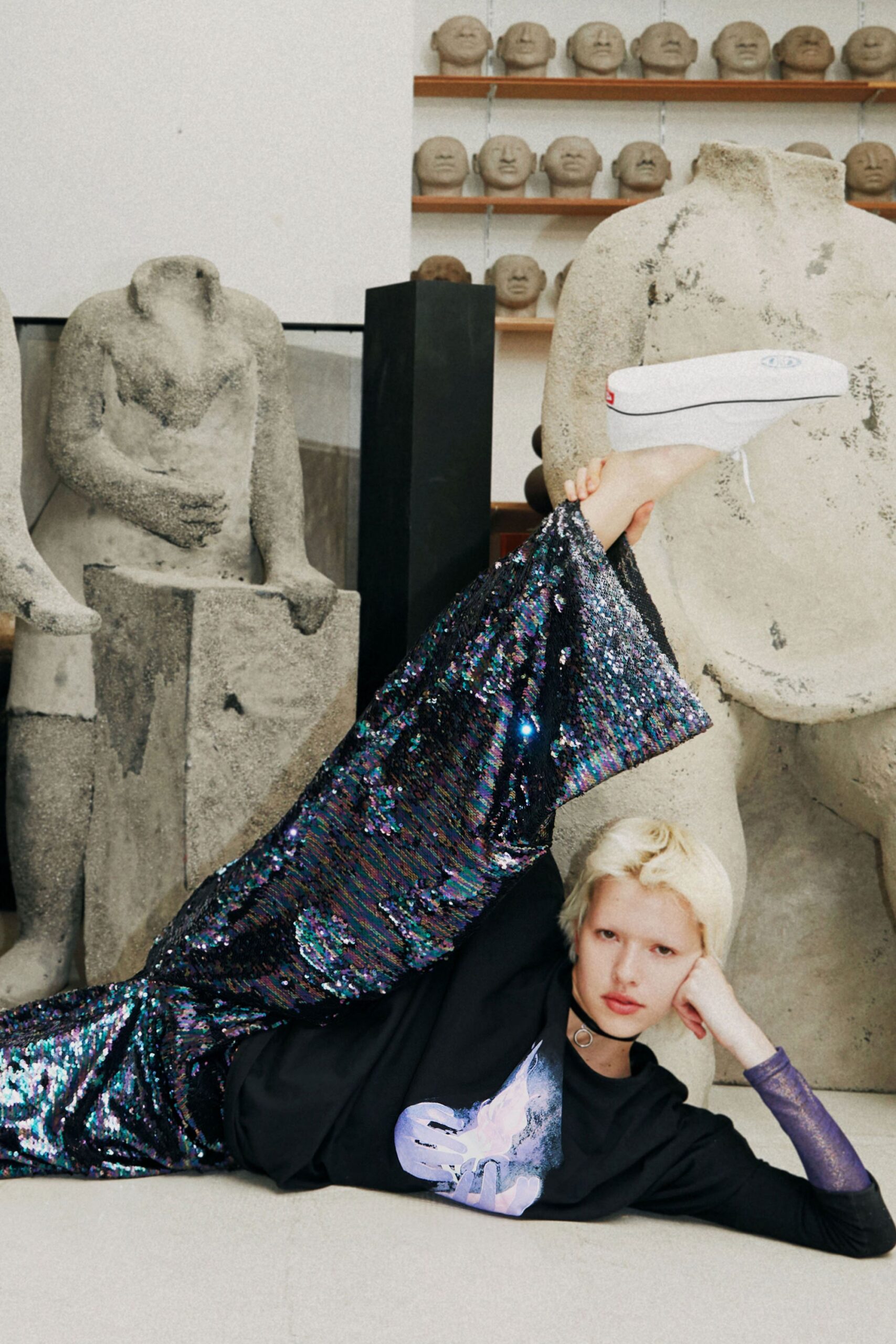 black relaxed top with flared sequin pants