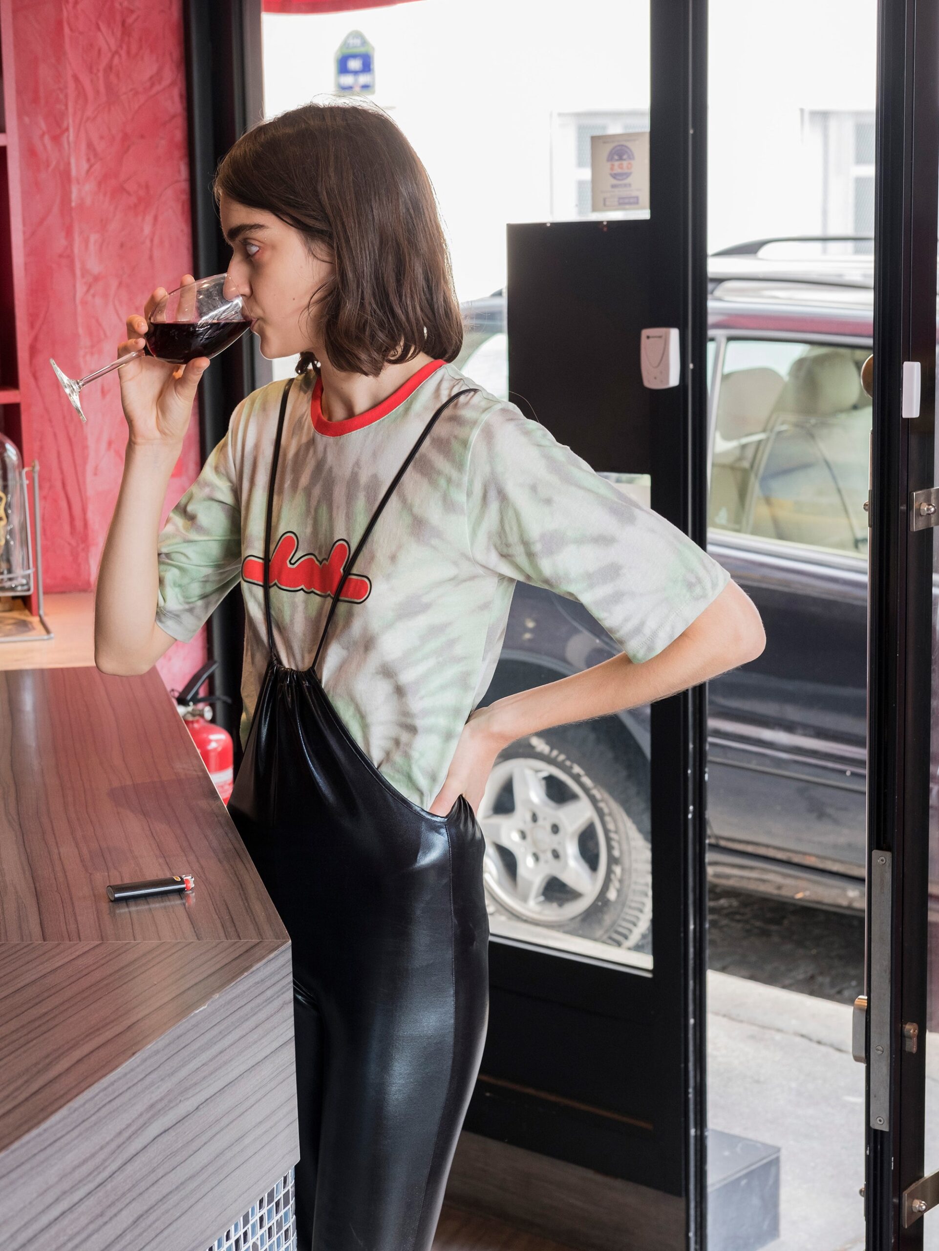 green printed top with black jumpsuit