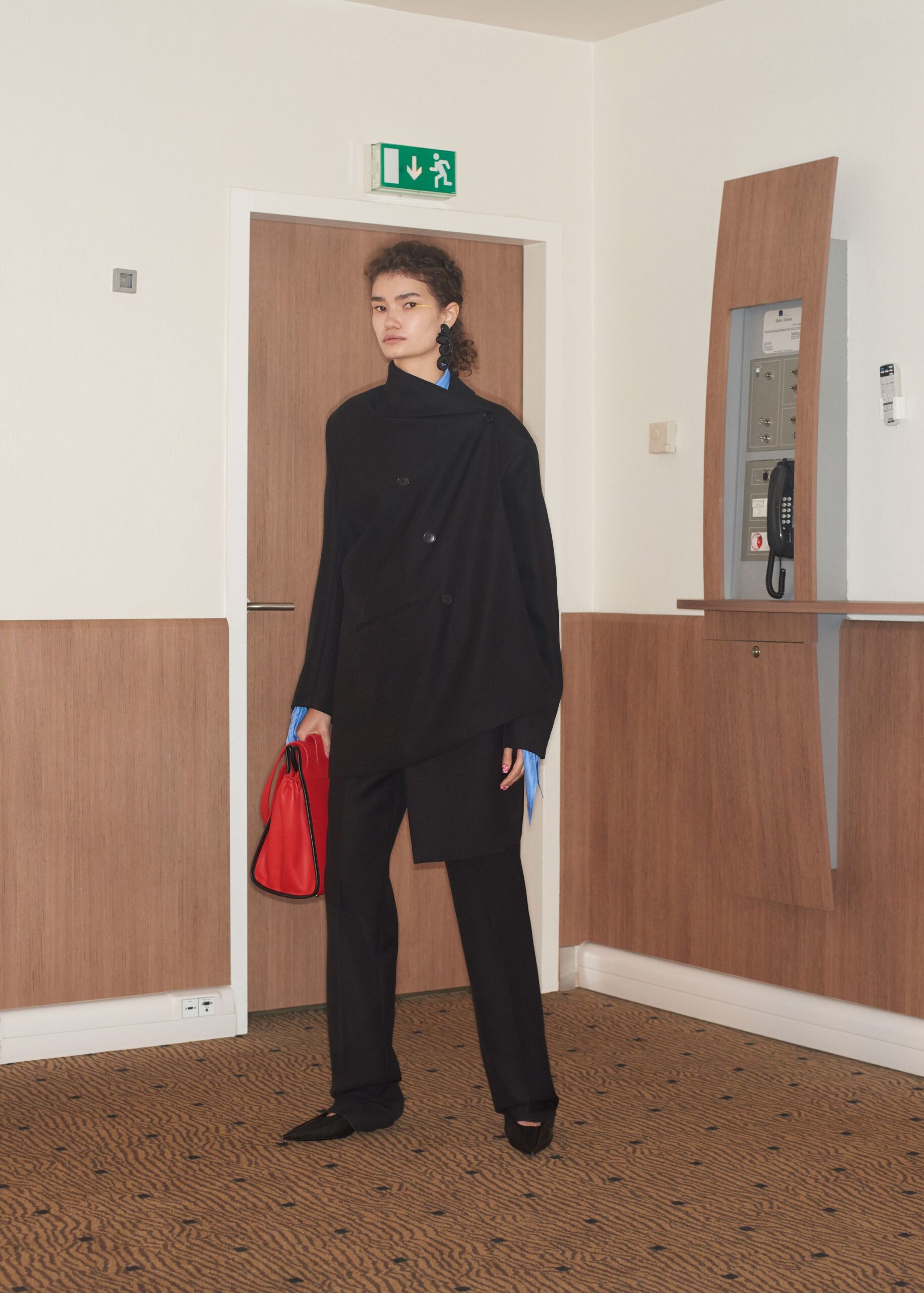 black wool long-sleeve collared relaxed buttoned cape