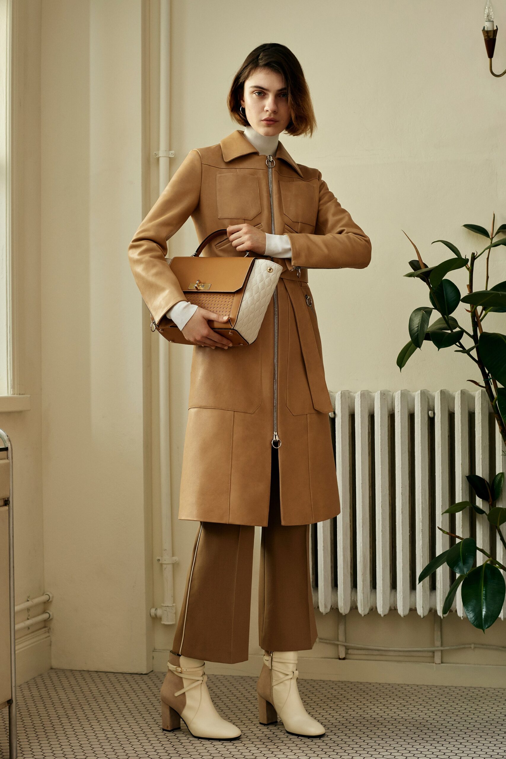 brown leather coat with tailored pants