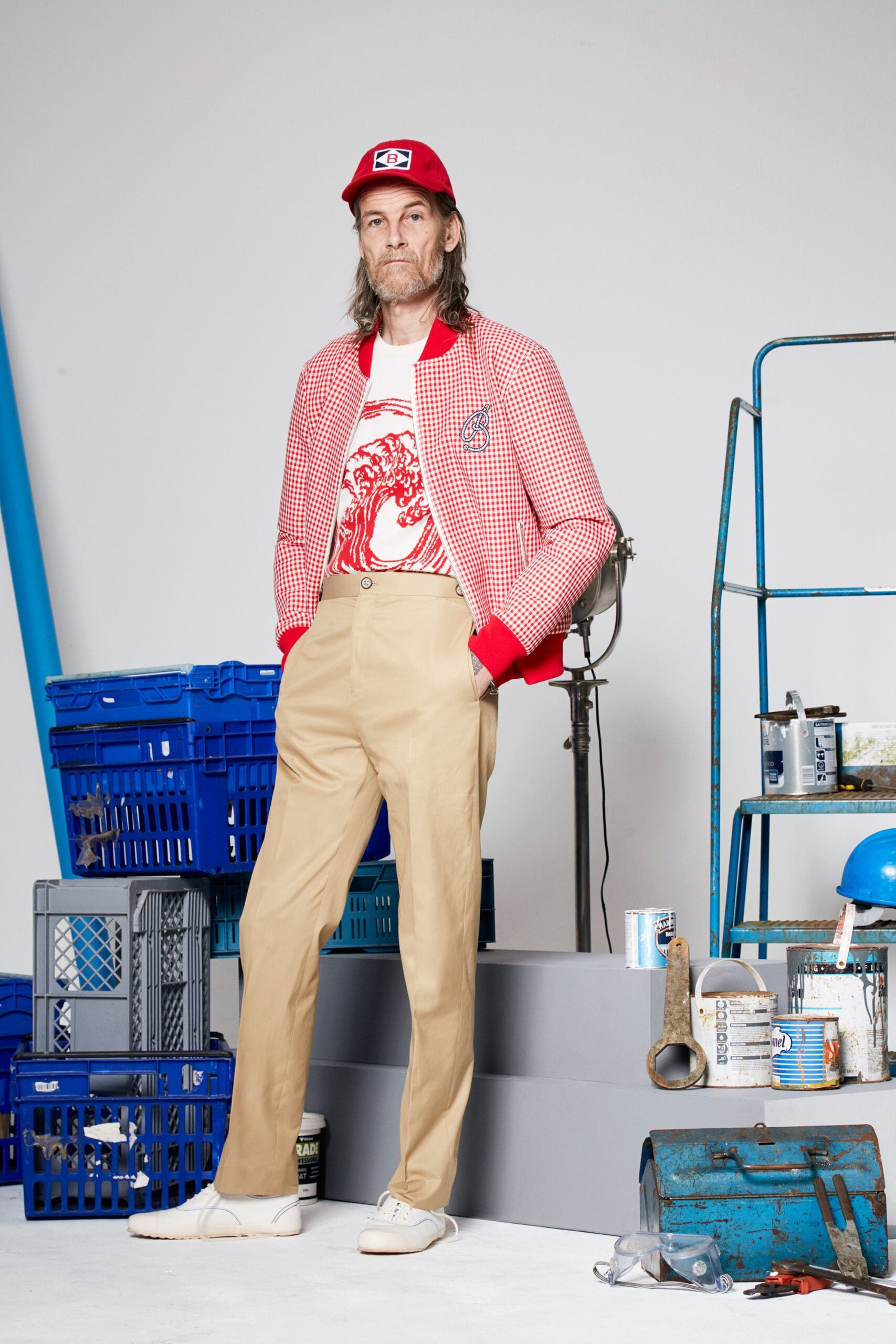 red and white checked jacket with beige pants