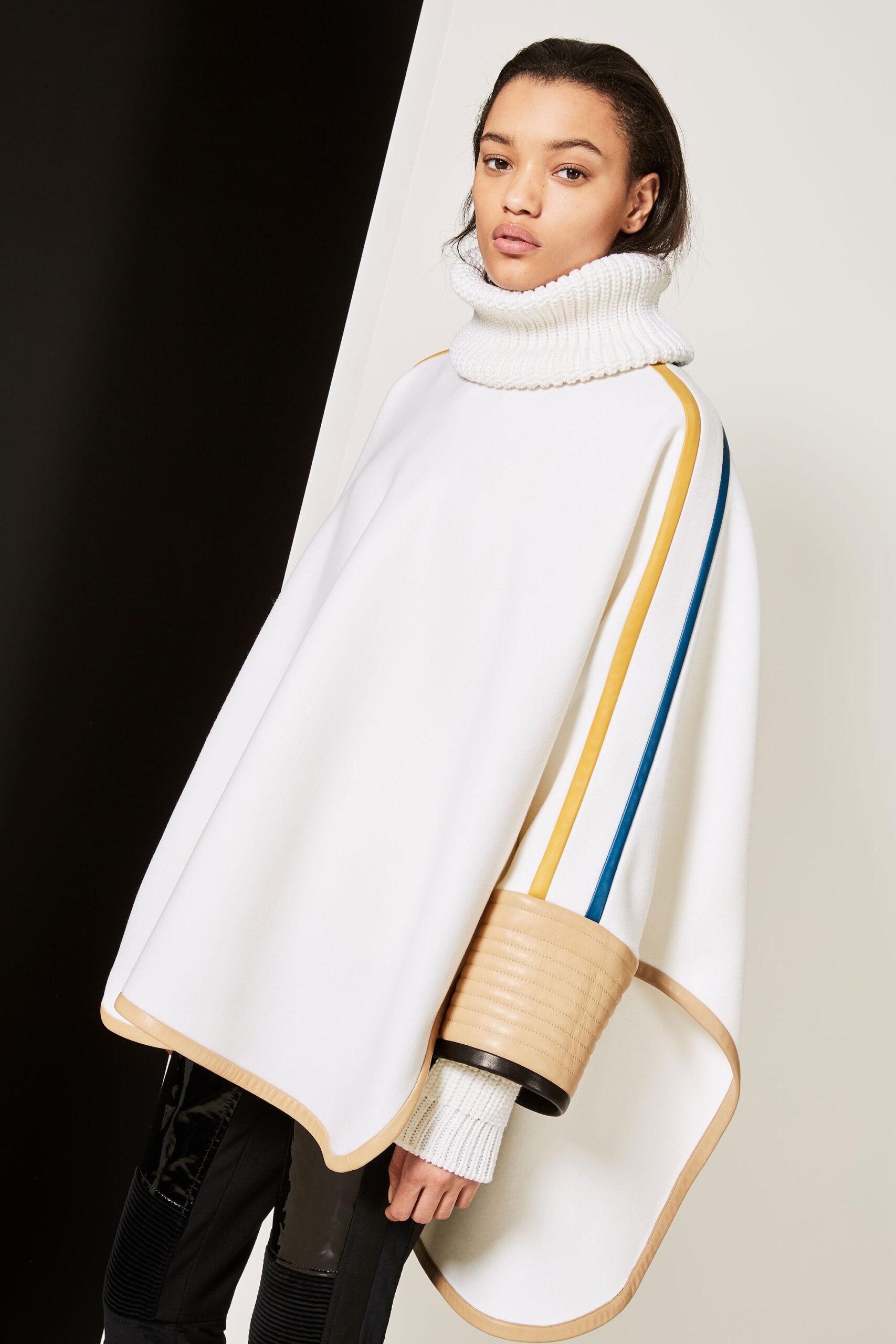 white wool sleeveless high-neck relaxed layered poncho