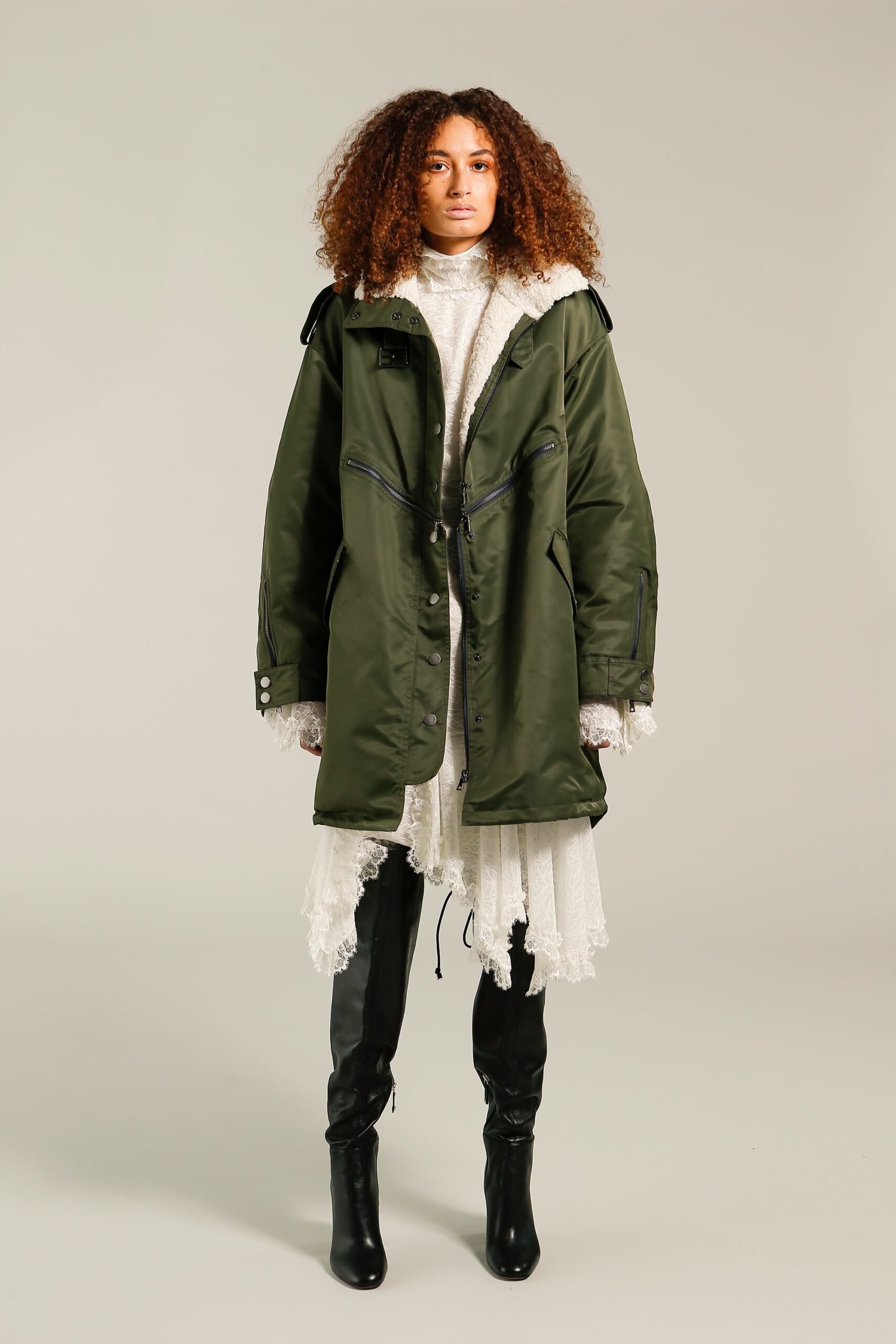 green parka with white lace dress
