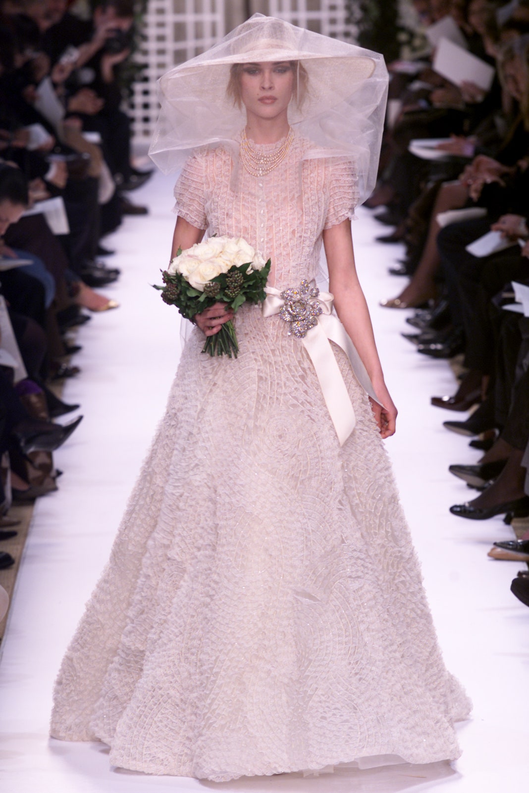 white pleated gown with hat