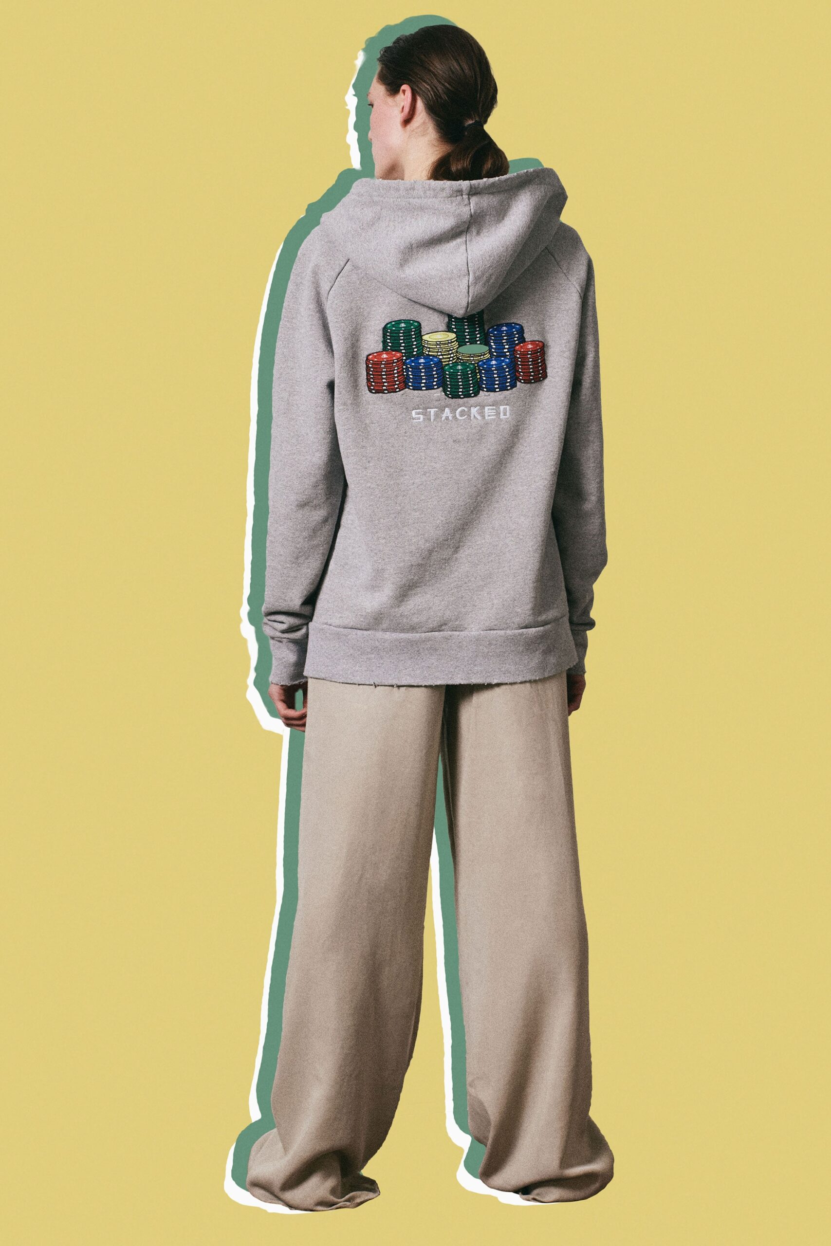 gray embroidered hoodie and beige pants