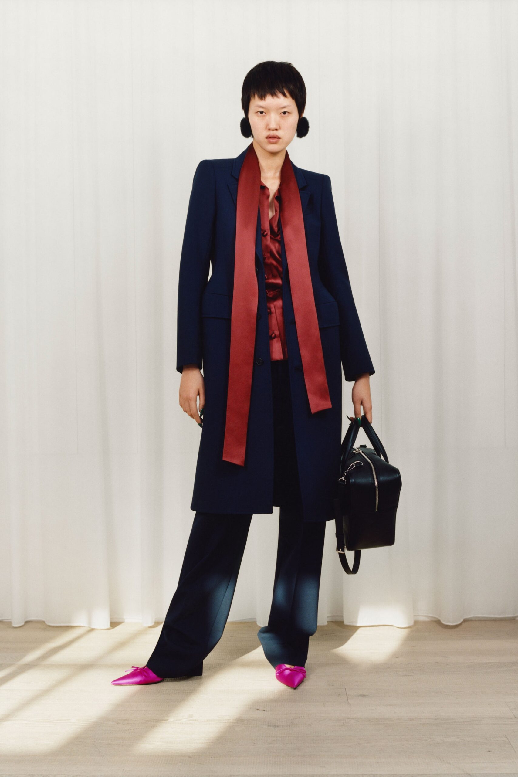 black tailored coat with red shirt