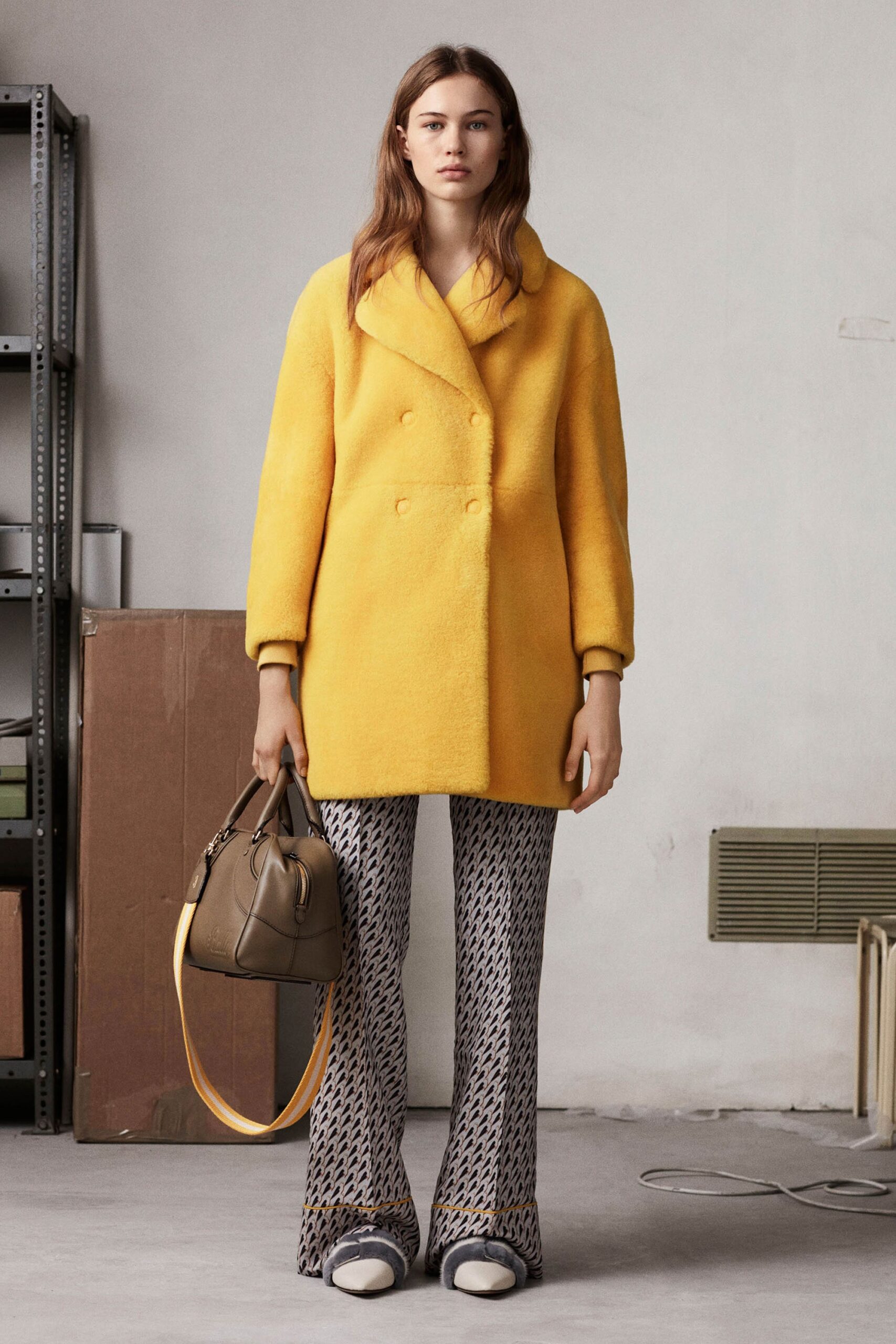 yellow wool coat and gray flared pants