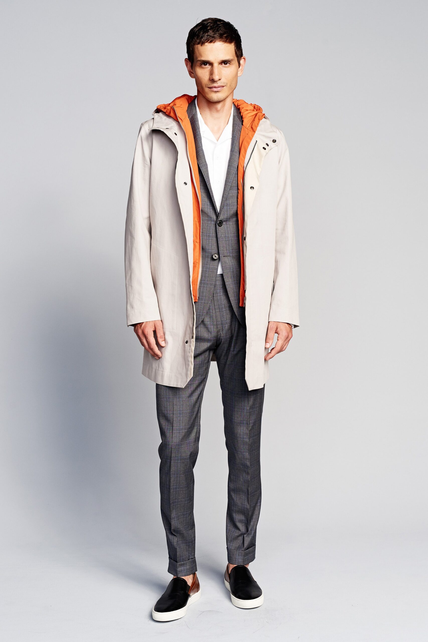 beige coat with orange hood