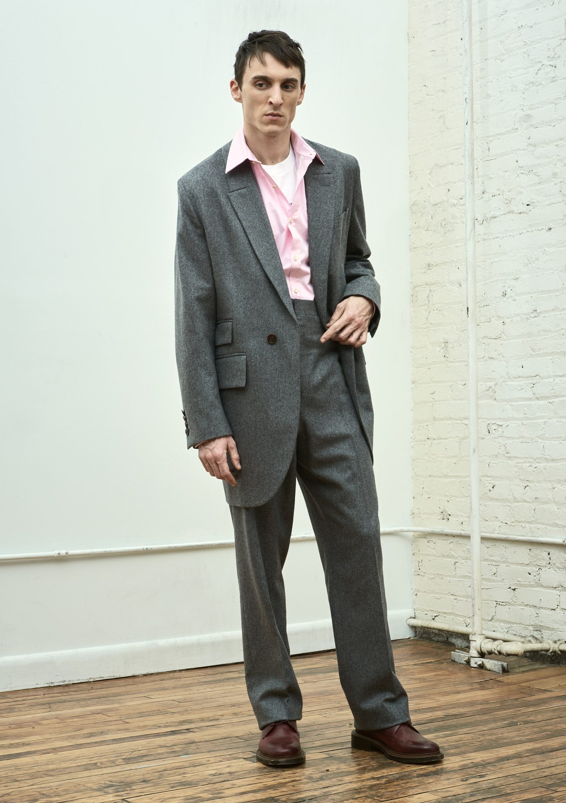 gray tailored suit with pink shirt