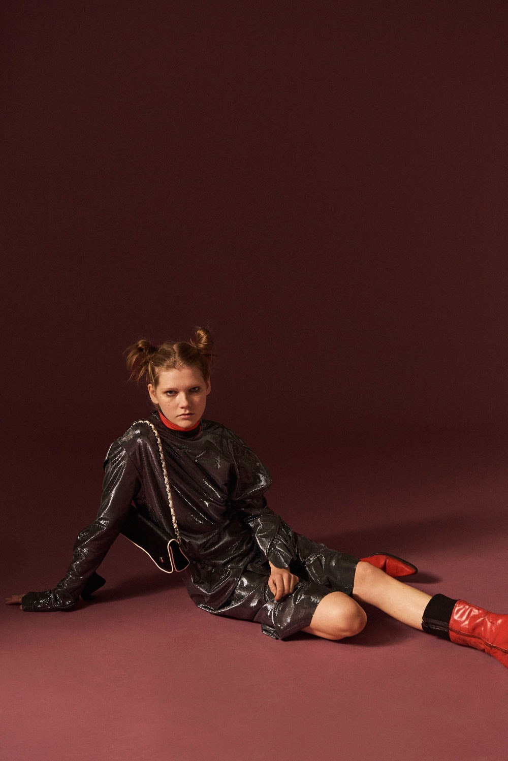 black vinyl mini dress with red boots