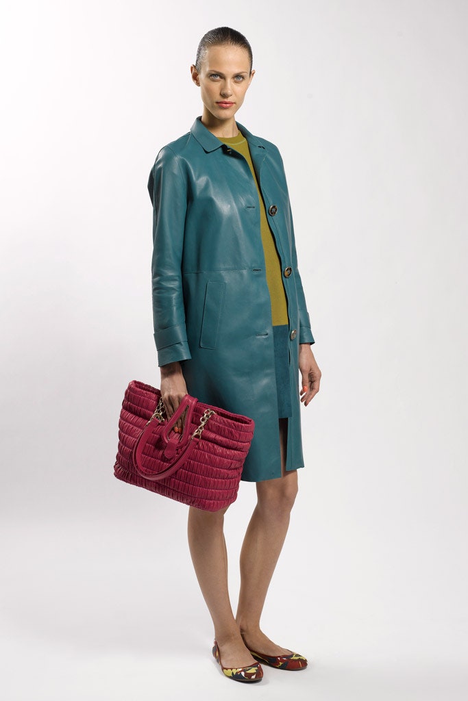 teal leather coat with yellow top