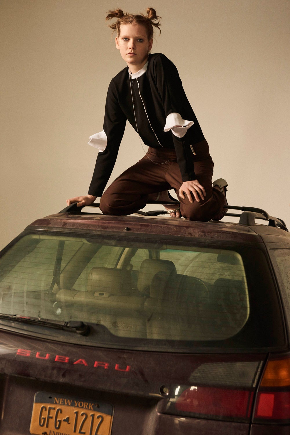 black fitted top and brown pants