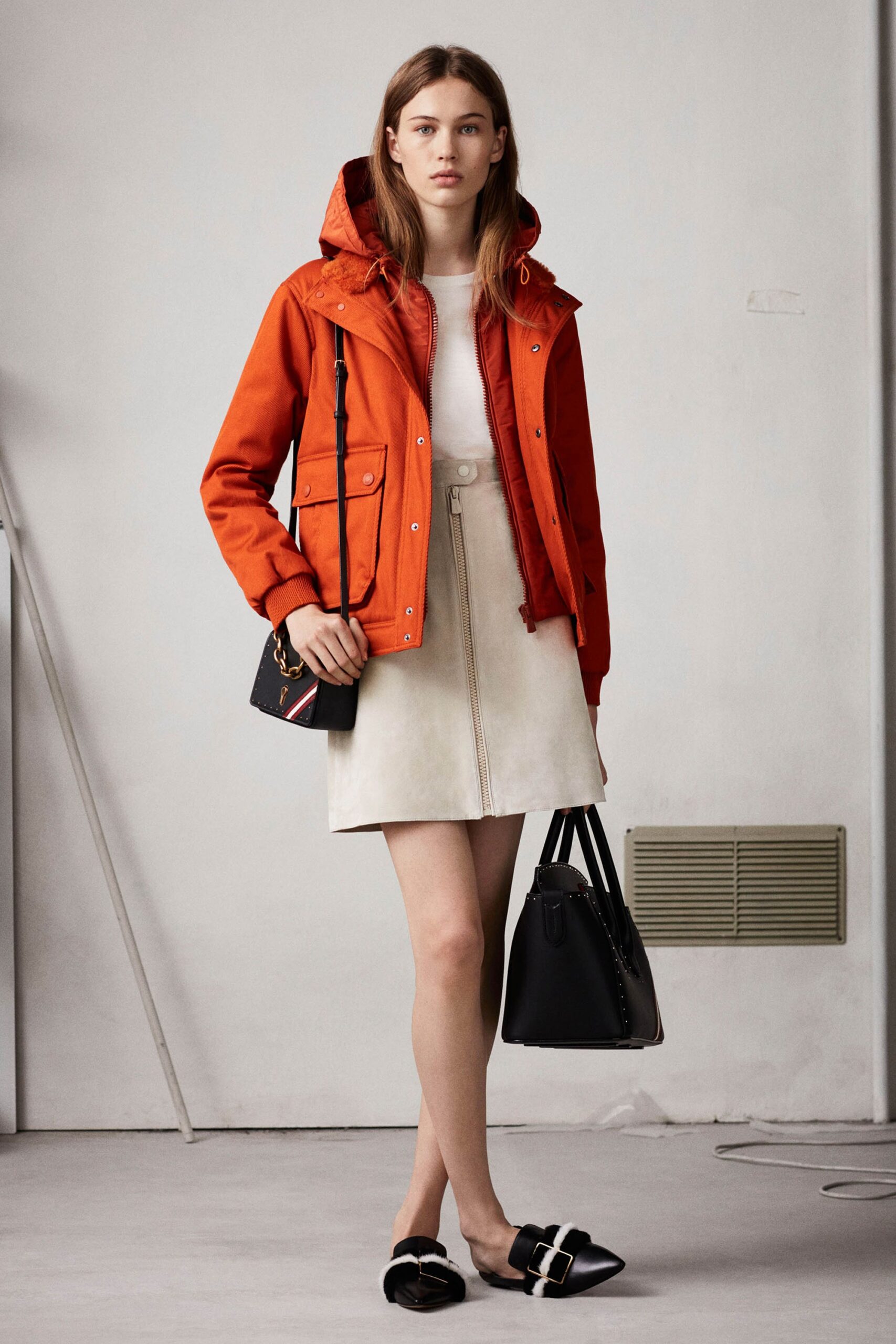 red jacket white top beige skirt