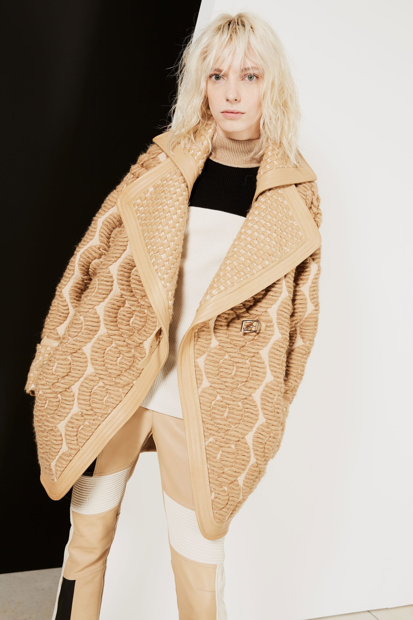 beige quilted cape black sweater