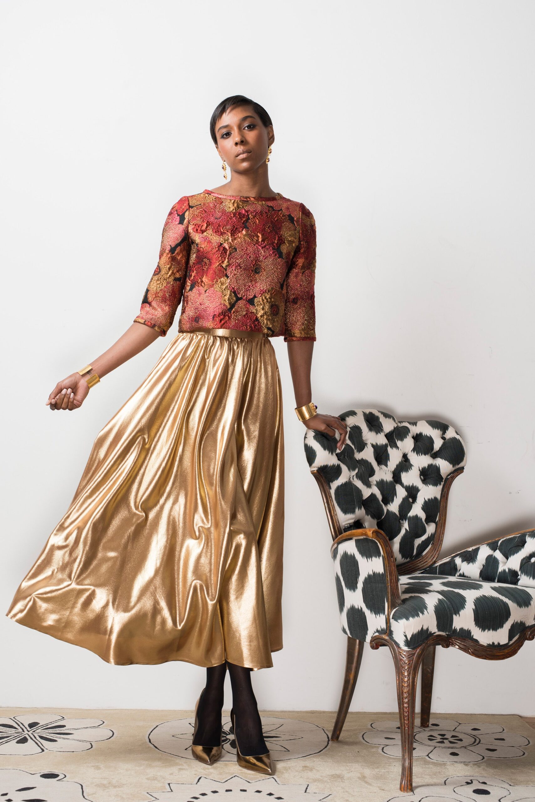 embroidered silk top and pleated skirt