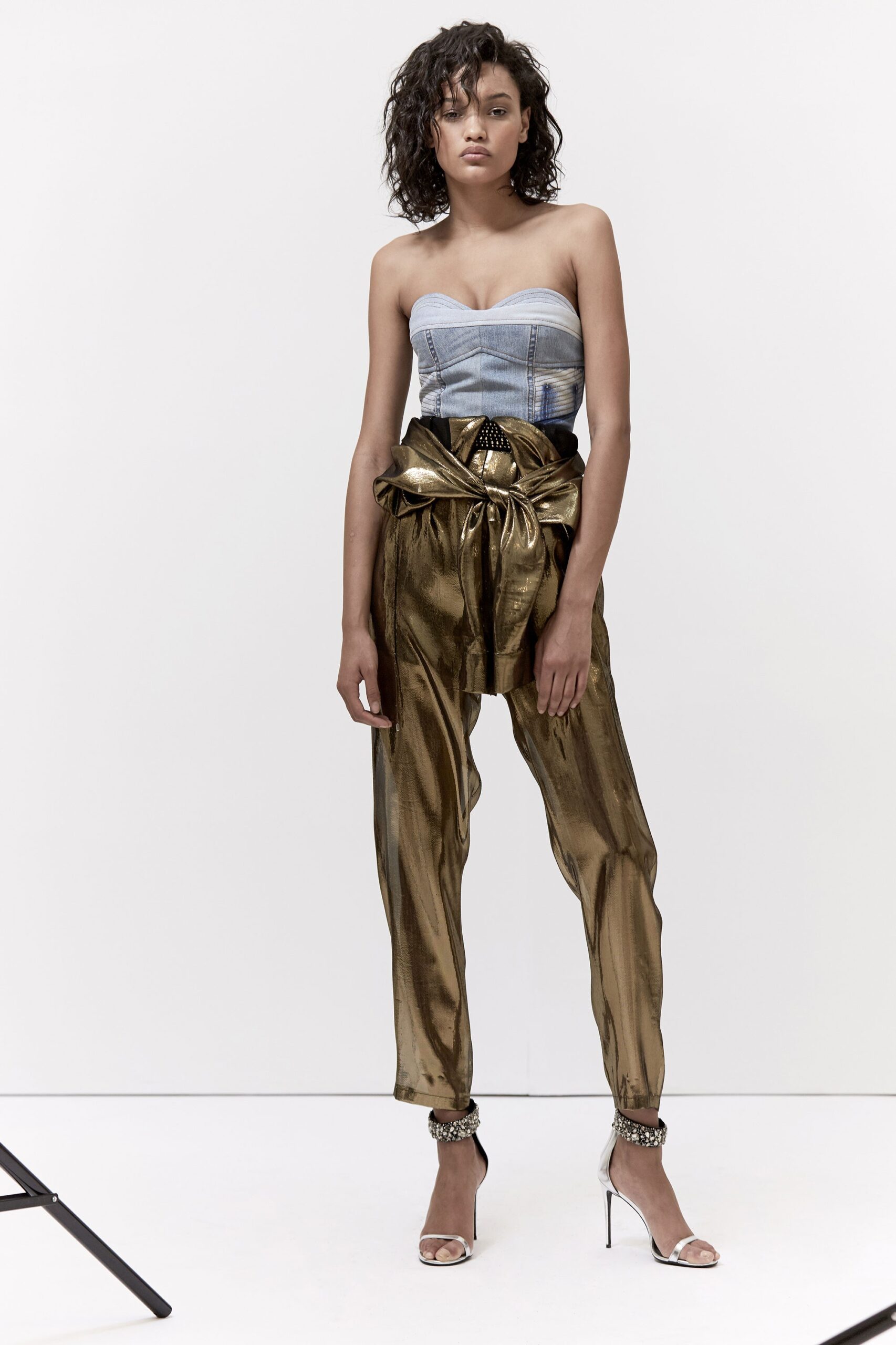 blue denim bustier with gold pants