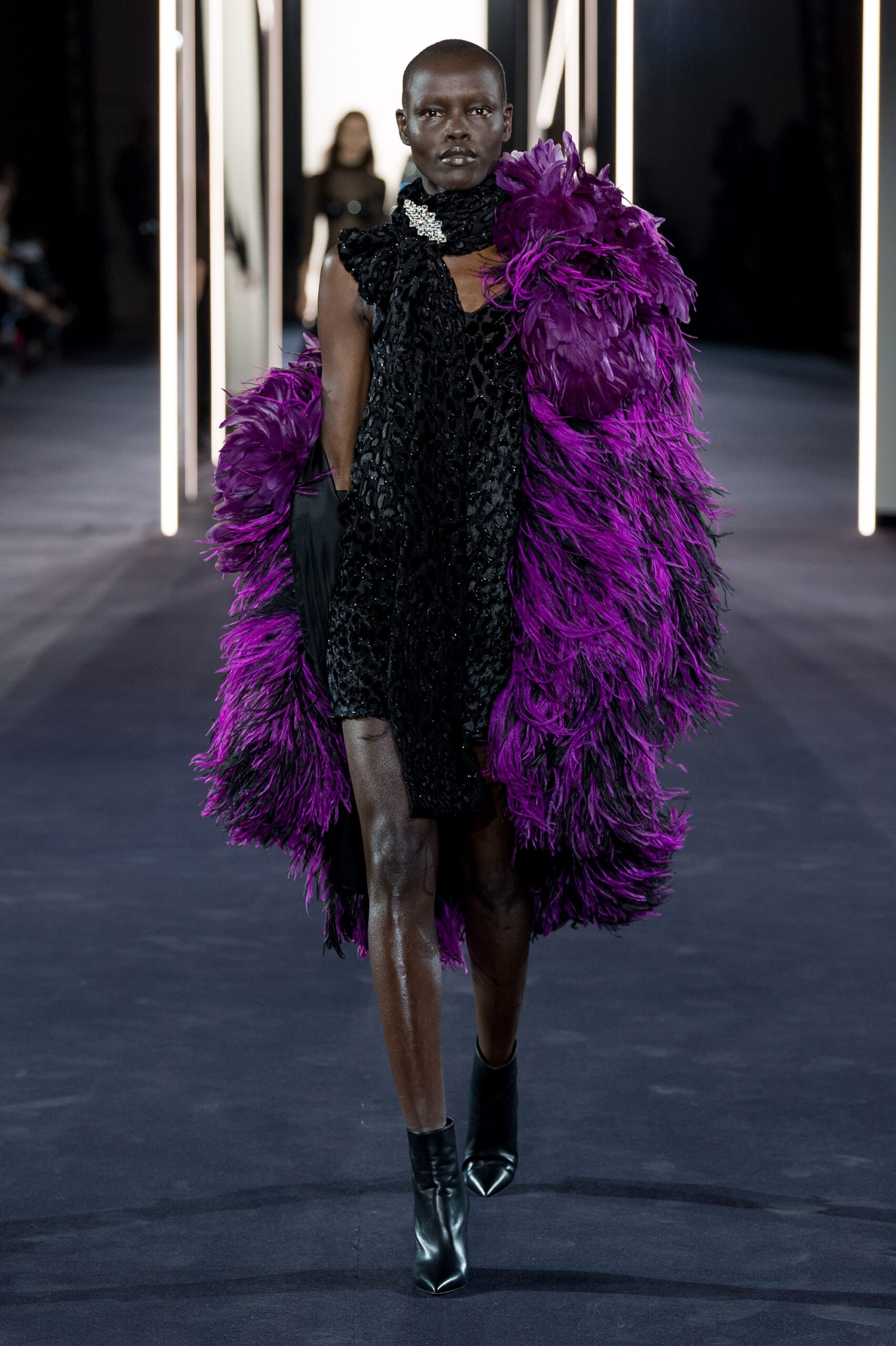black silk mini dress with purple feather cape