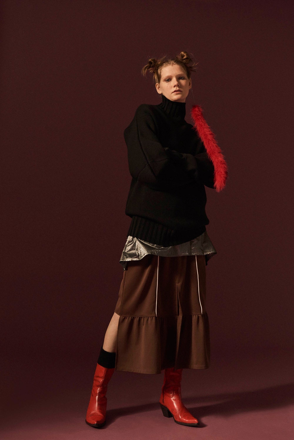 oversized black sweater with tiered brown skirt