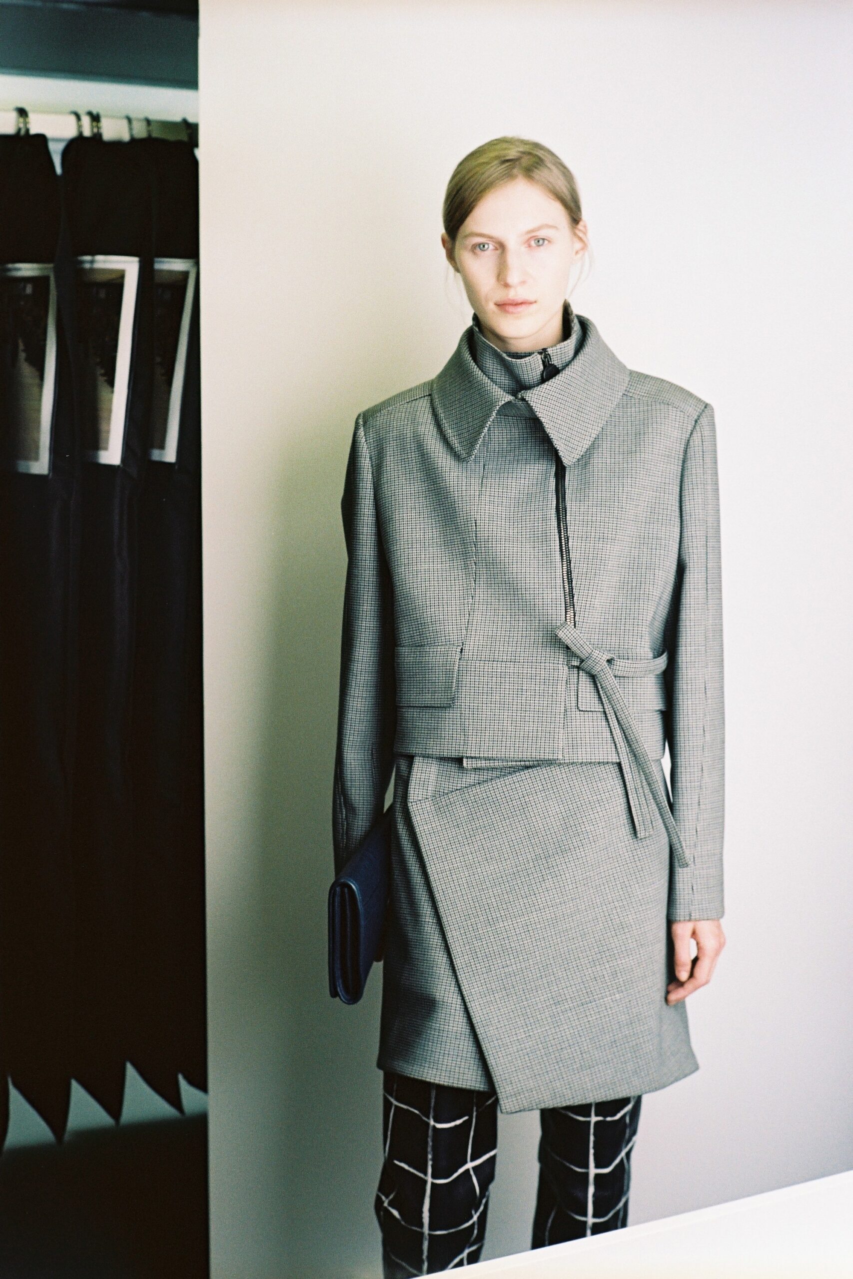 gray tailored coat with black pants